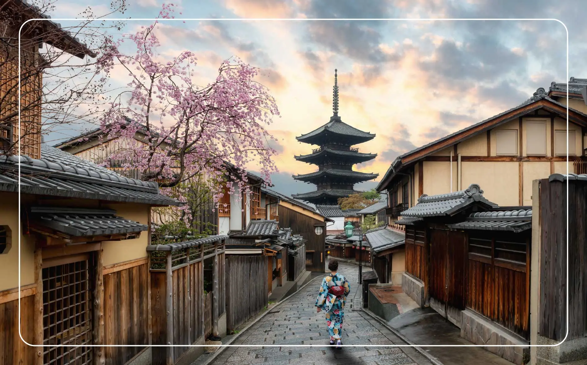 A woman wearing a traditional Japanese kimono heads towards a Kiyomizudera Temple in Kyoto.