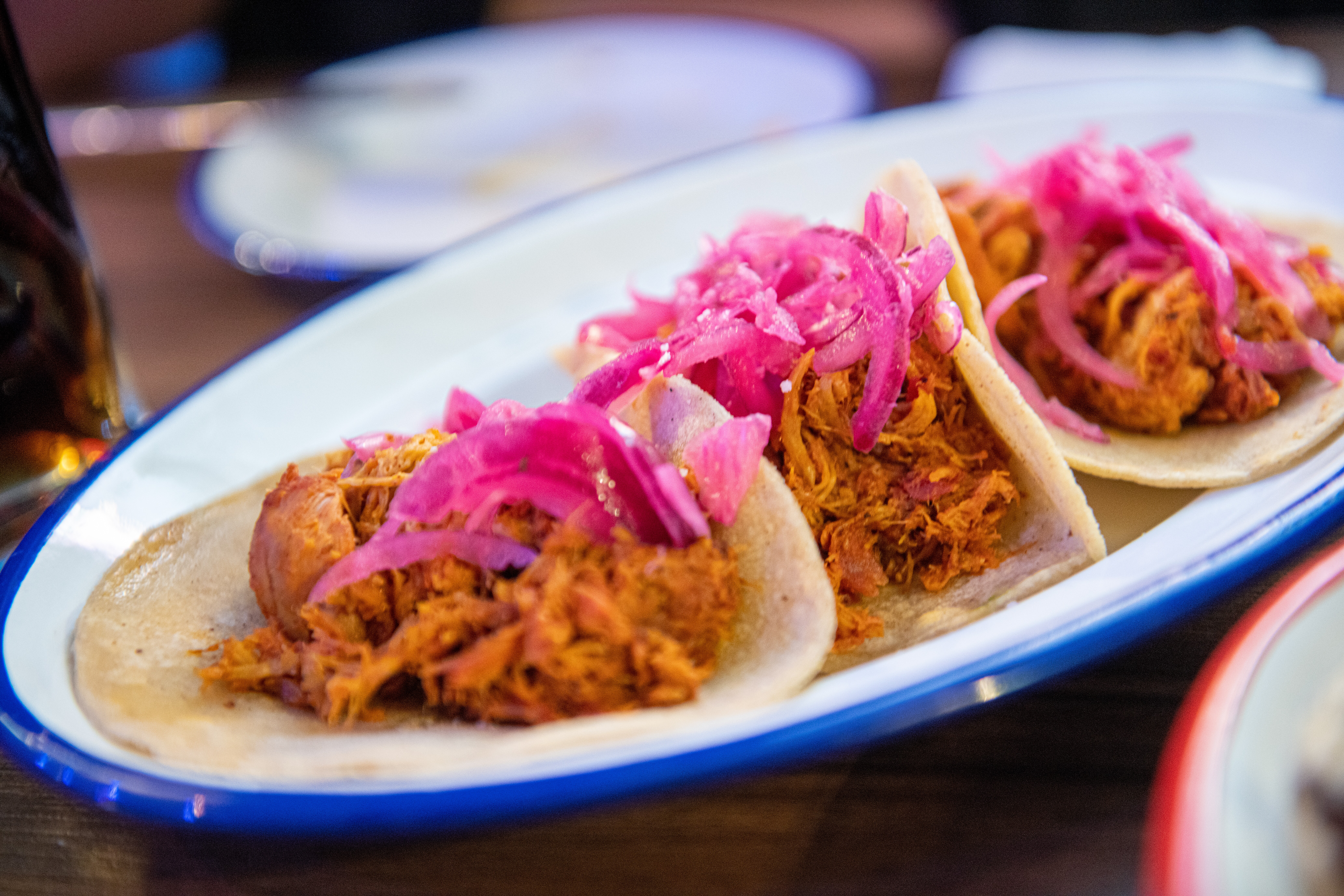 Image of a dish of Cochinita Pibil tacos.