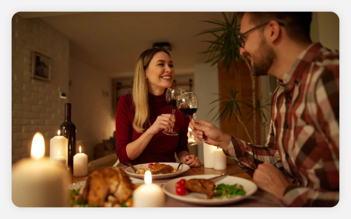 A couple enjoying a candlelit dinner together