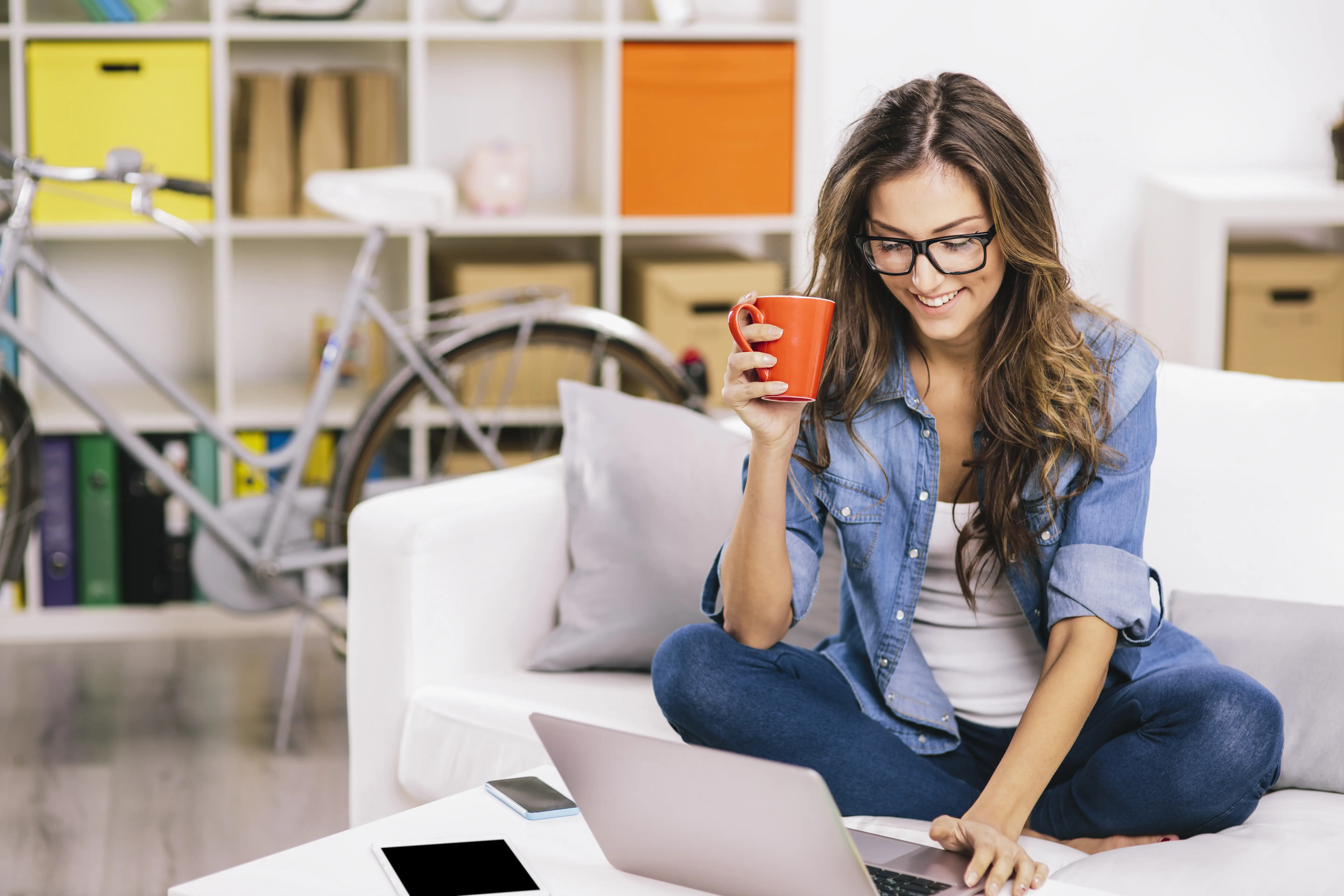 Woman on couch with laptop