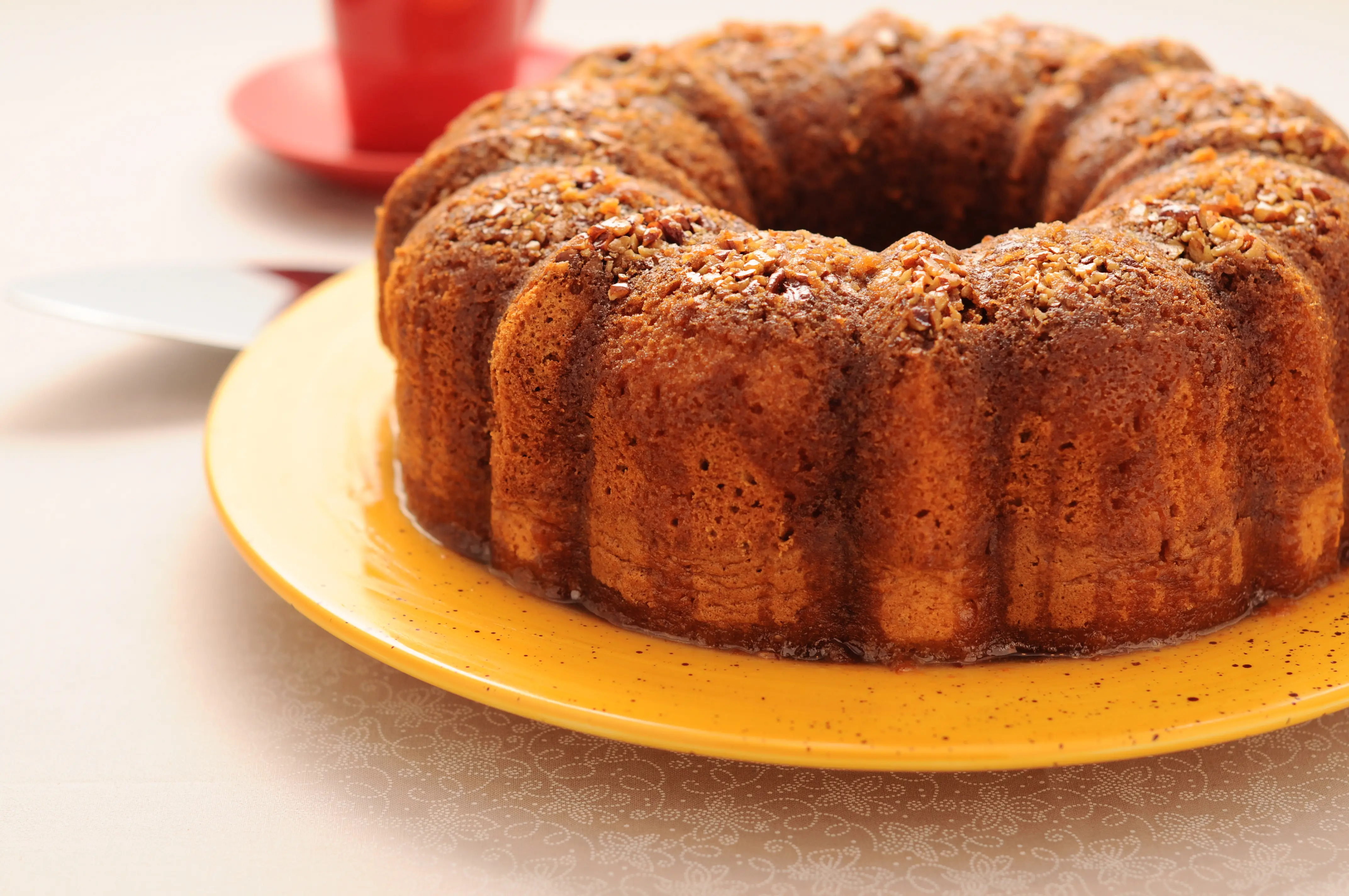 Image of a Jamaican Rum Cake, made from dried fruit soaked in rum, warm spices, and wine.