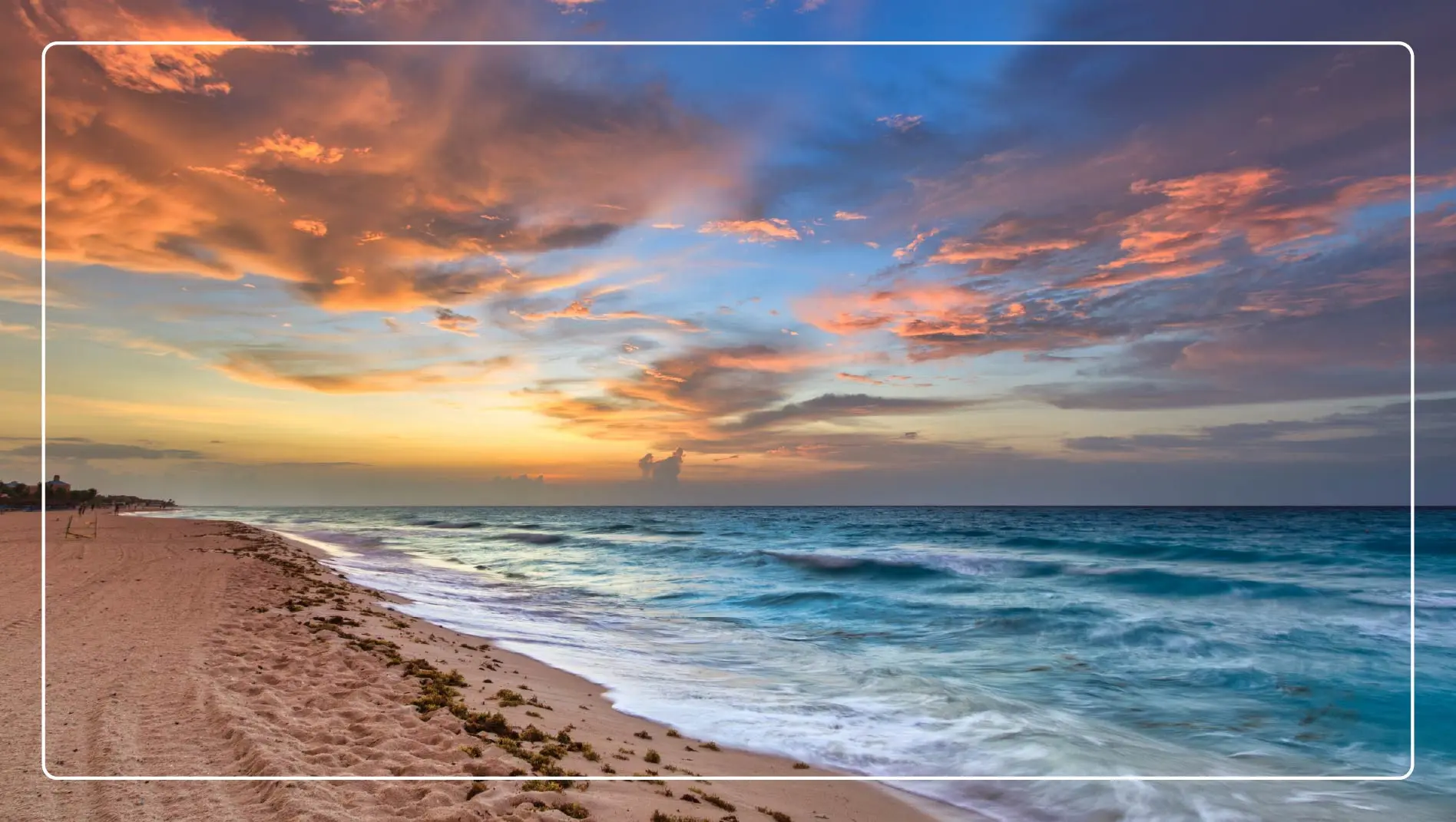 A tranquil beach in Playa Del Carmen, Mexico at sunrise.