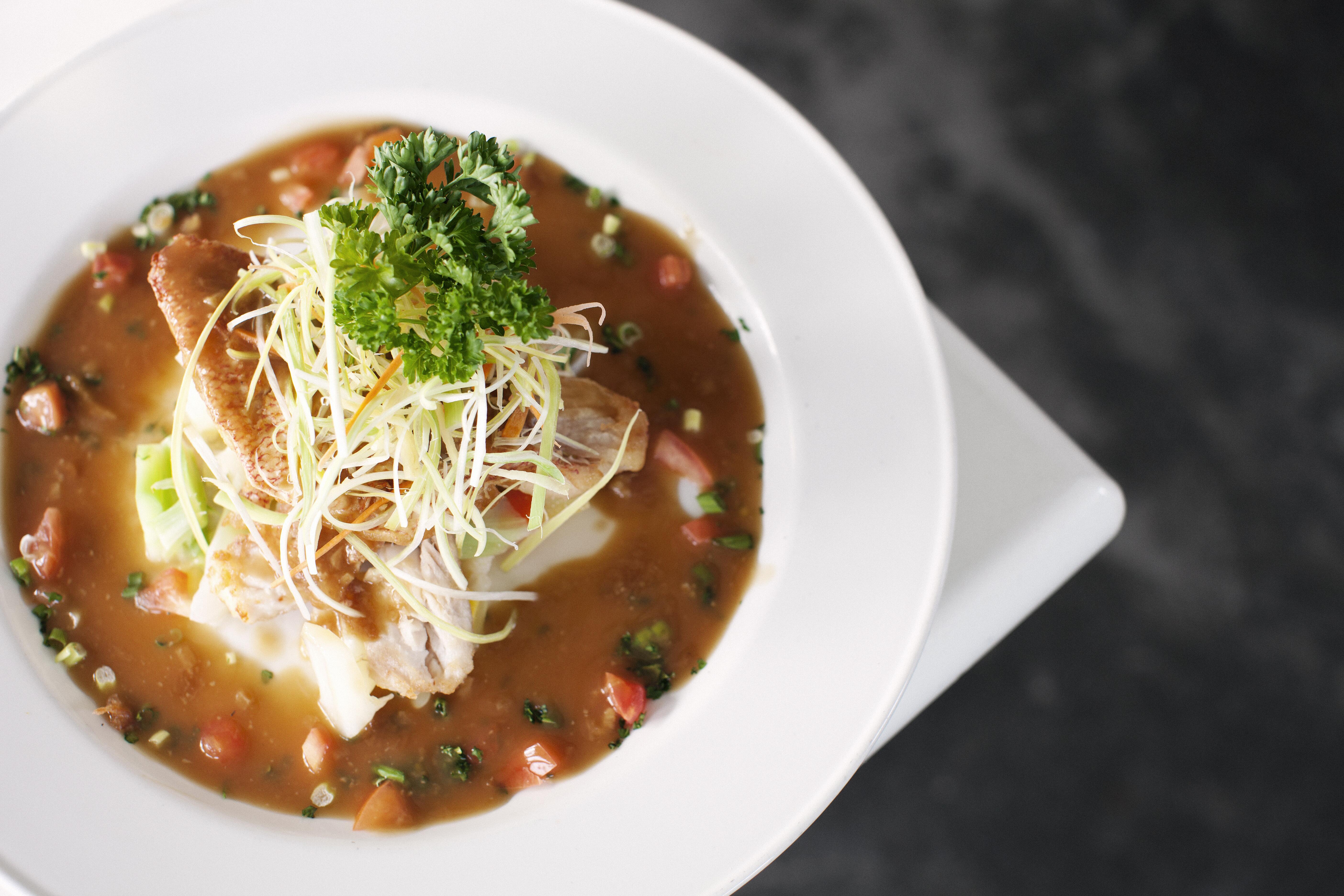 Closeup image of a bowl of seafood gumbo.