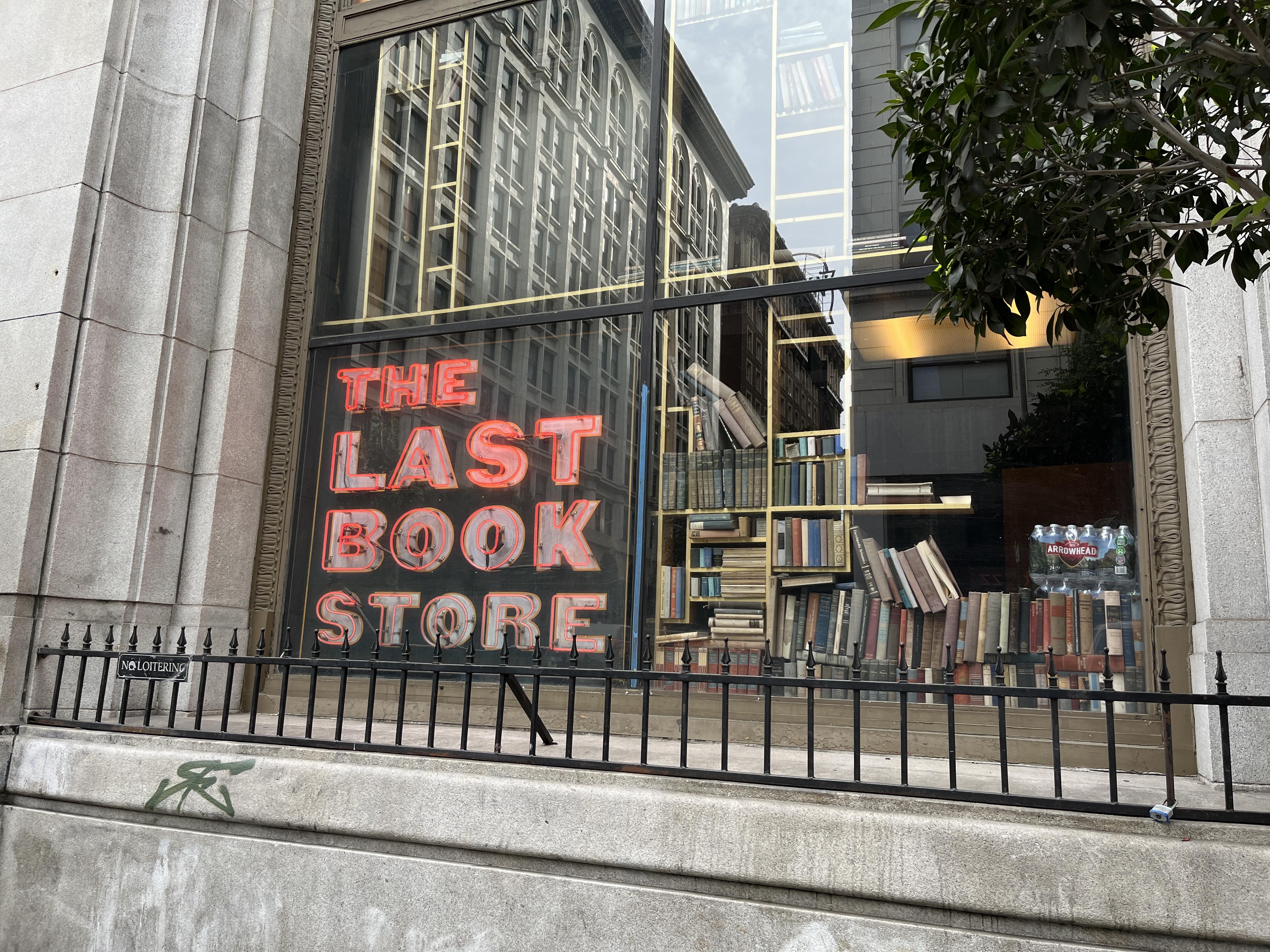 Image of the exterior and window sign for The Last Bookstore in Los Angeles, California.