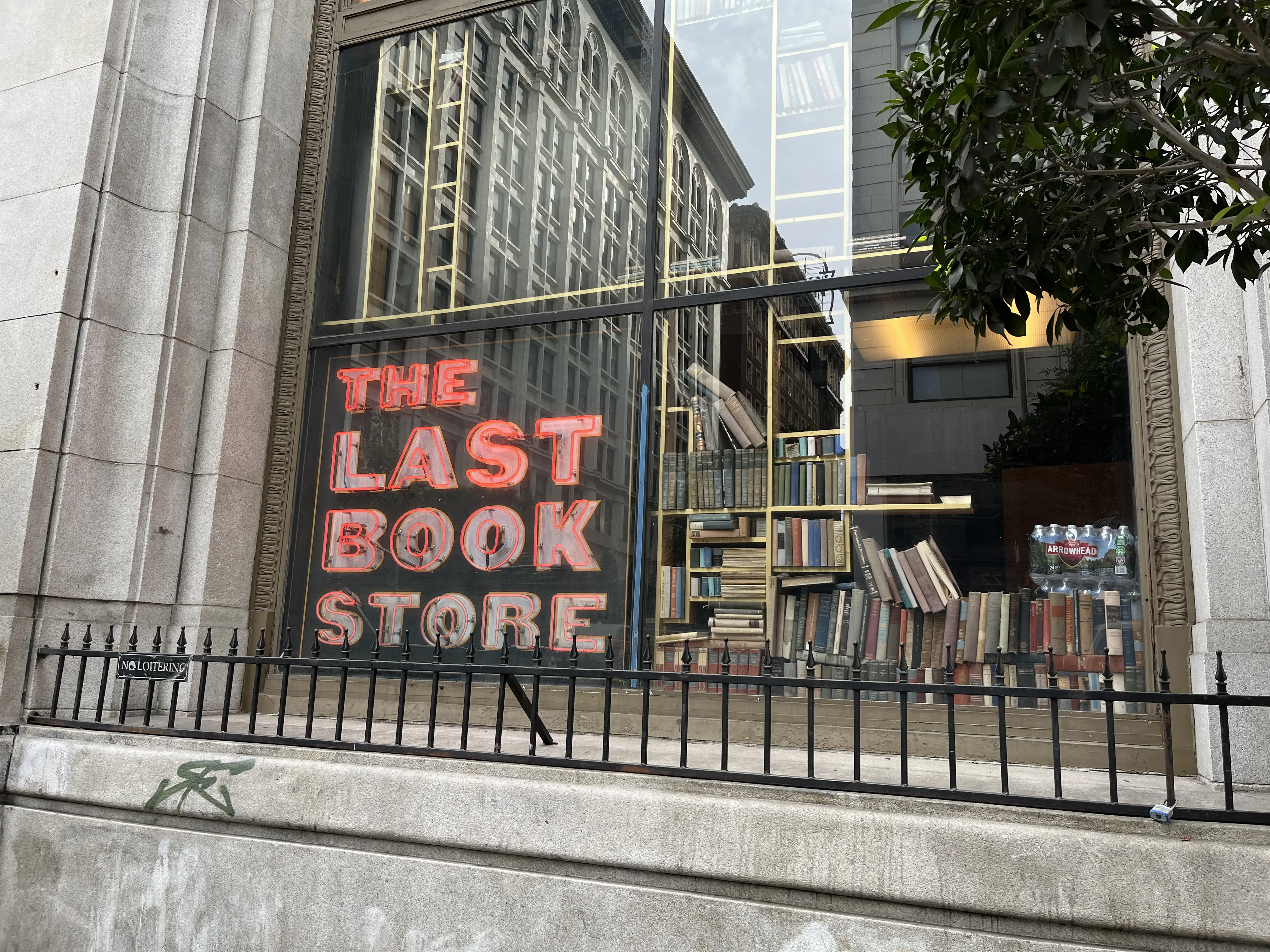 Image of the exterior and window sign for The Last Bookstore in Los Angeles, California.