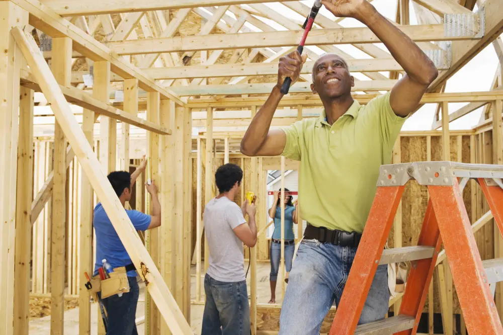 Volunteers helping to build a home