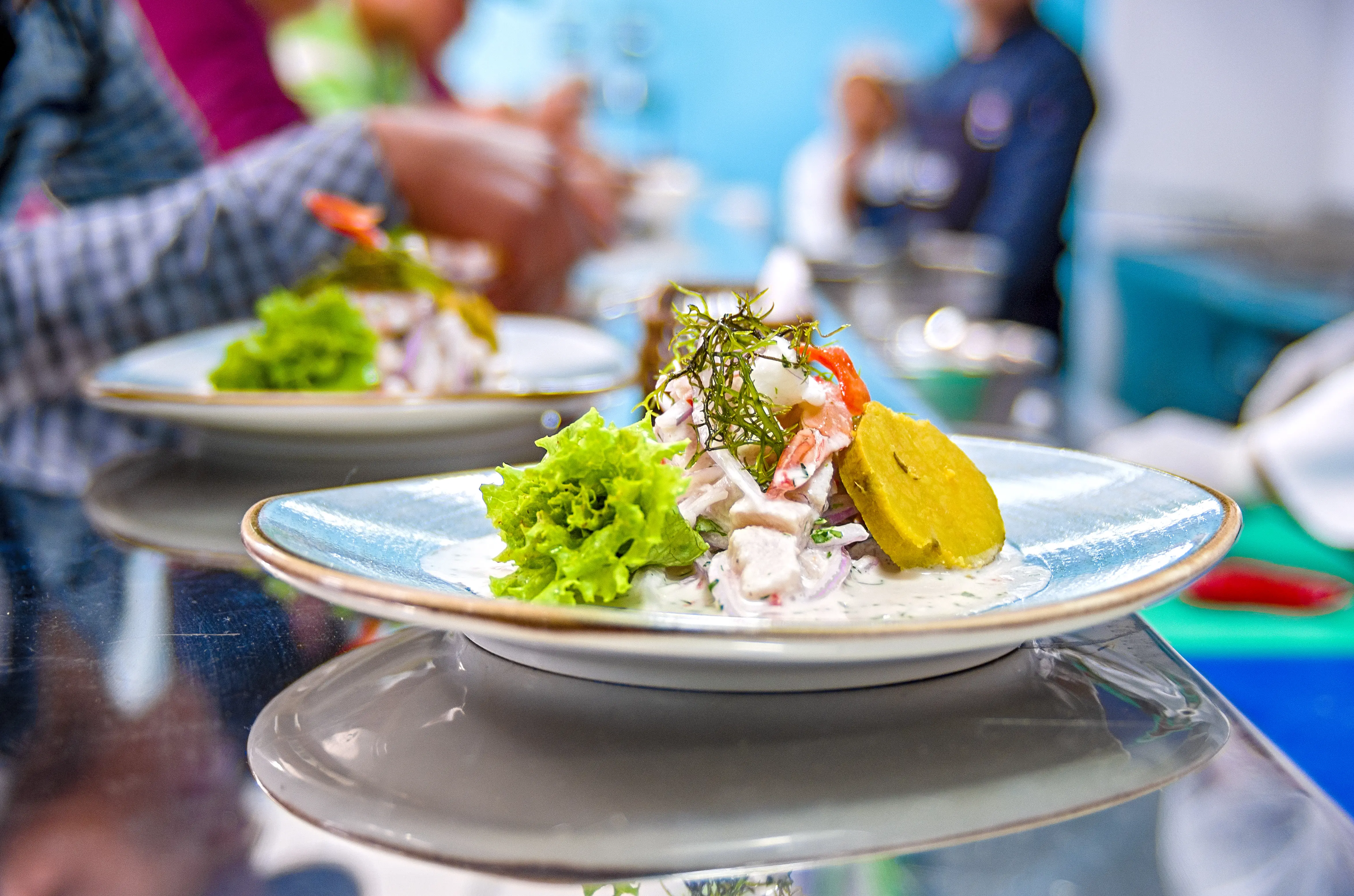 Closeup image of cebiche marine food based on raw fish onion and lemon.