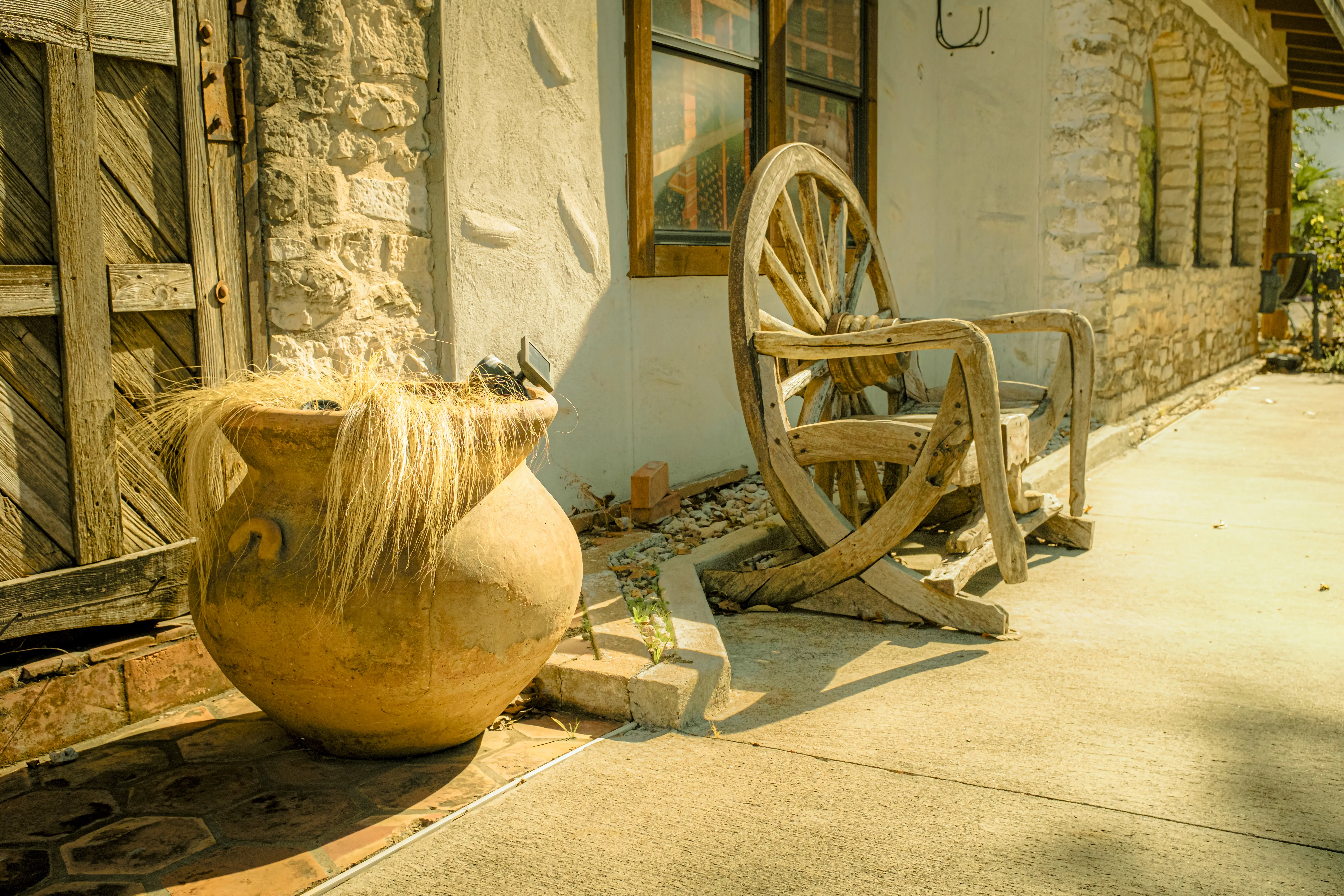 Wagon wheel chair on a southwestern porch in Georgetown