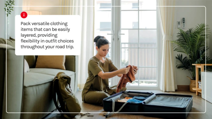 A woman packing up her suitcase for her trip. 