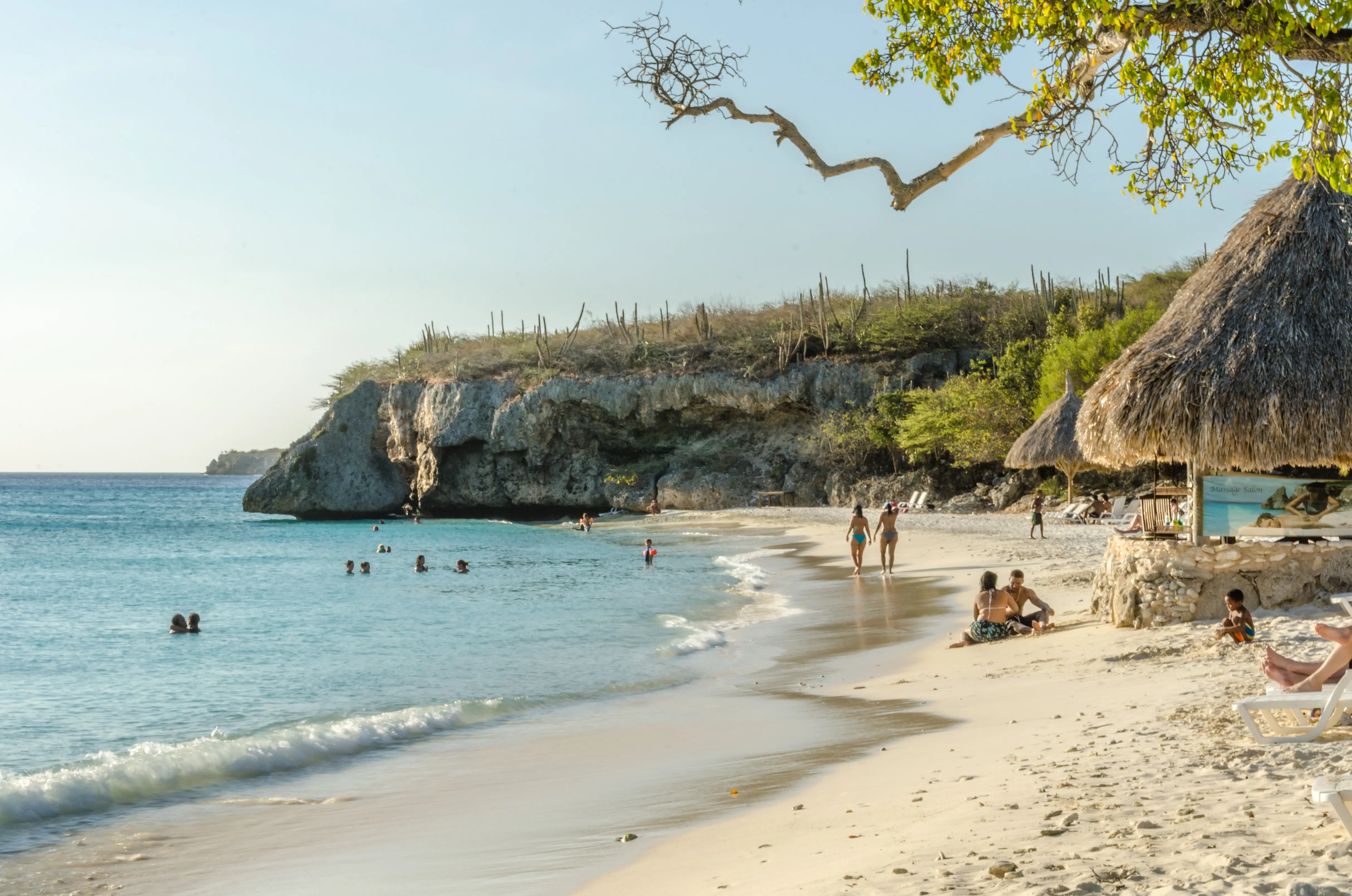Image of the shore and rocky cliffs of Grote Knip Beach, Curaçao.
