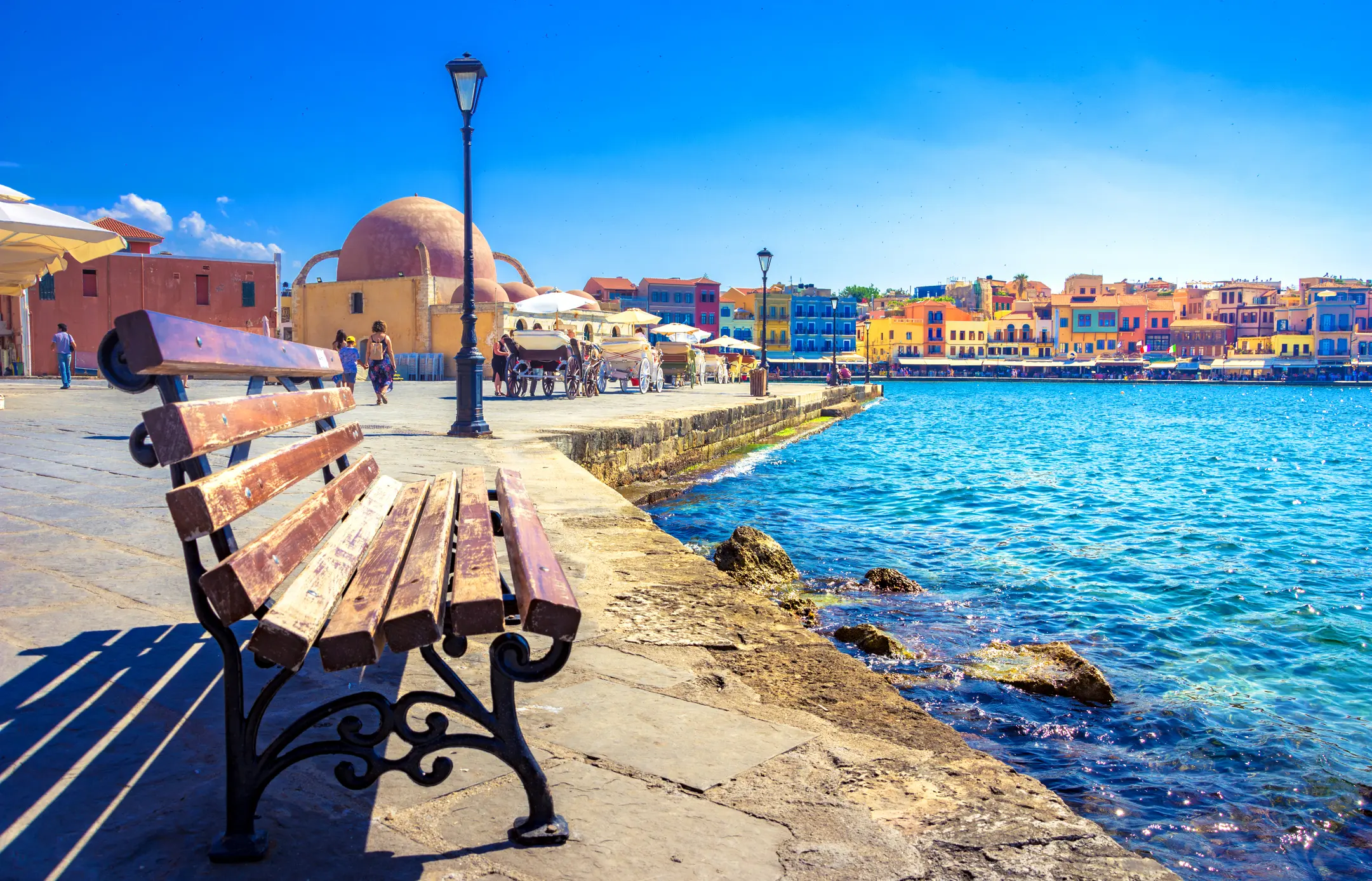 Panorama of the beautiful old harbor of Chania with the amazing lighthouse, mosque, venetian shipyards, Crete, Greece
