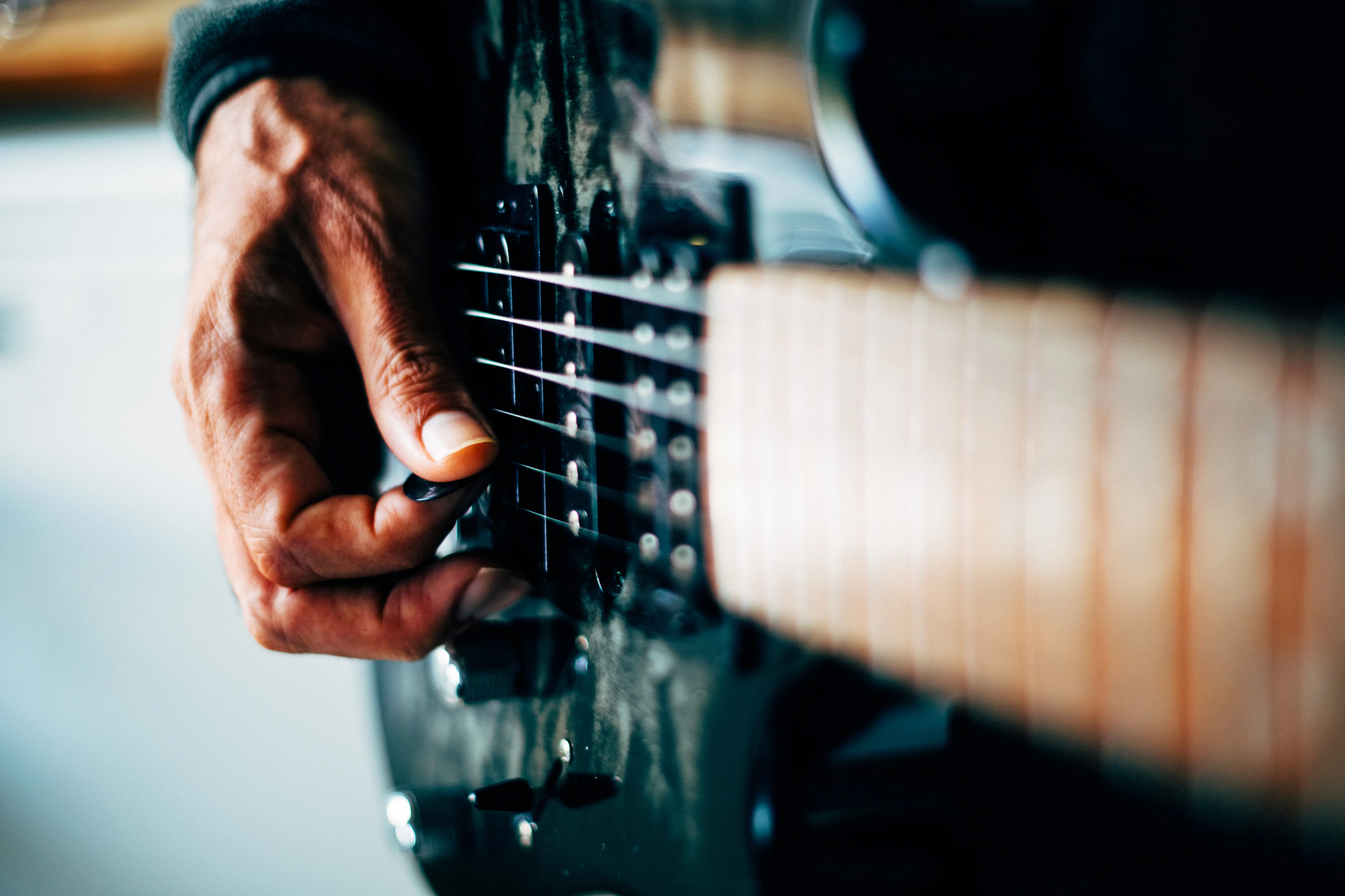 Blues musician playing a guitar