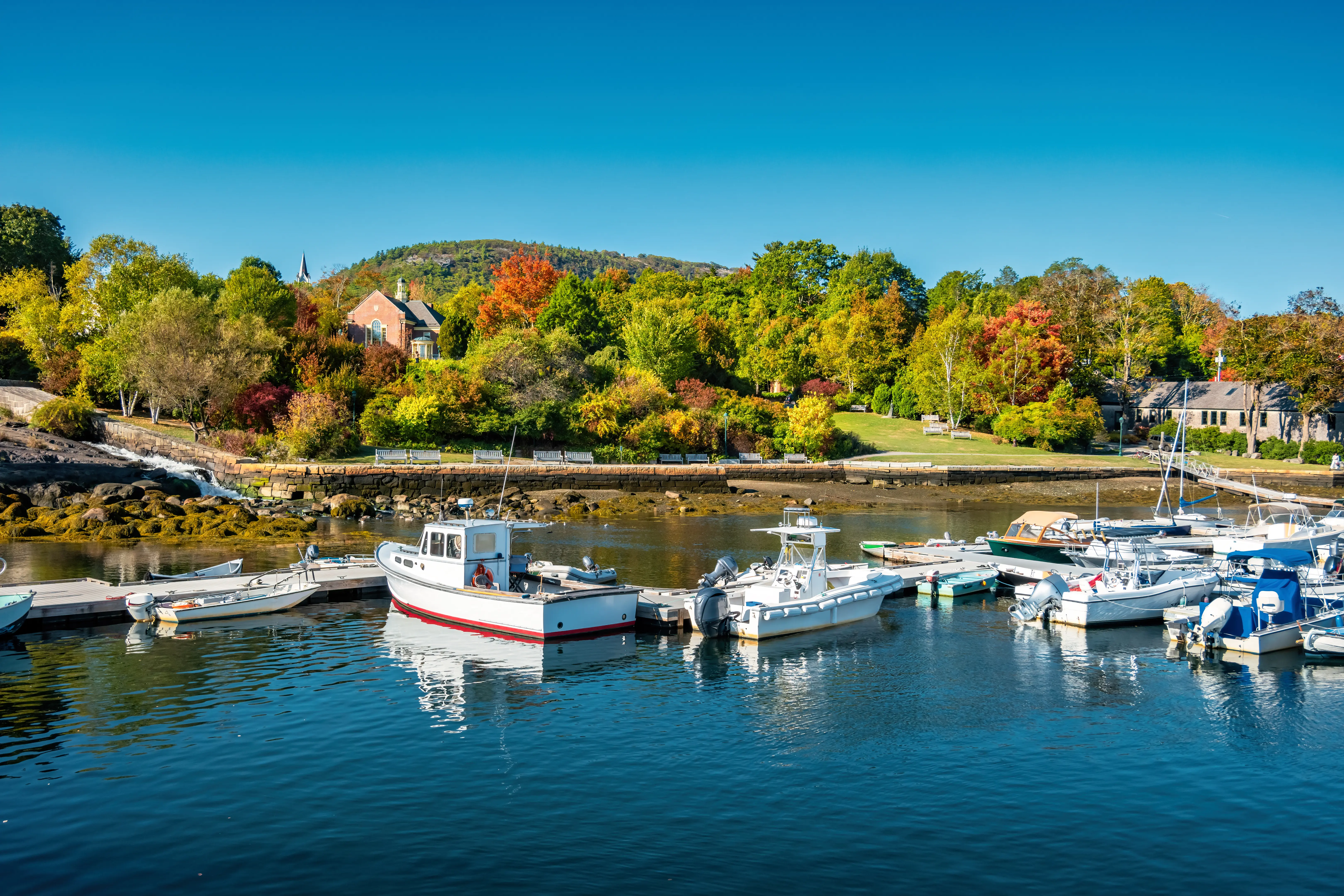 Image of a harbor in Camden, Maine, in the fall.
