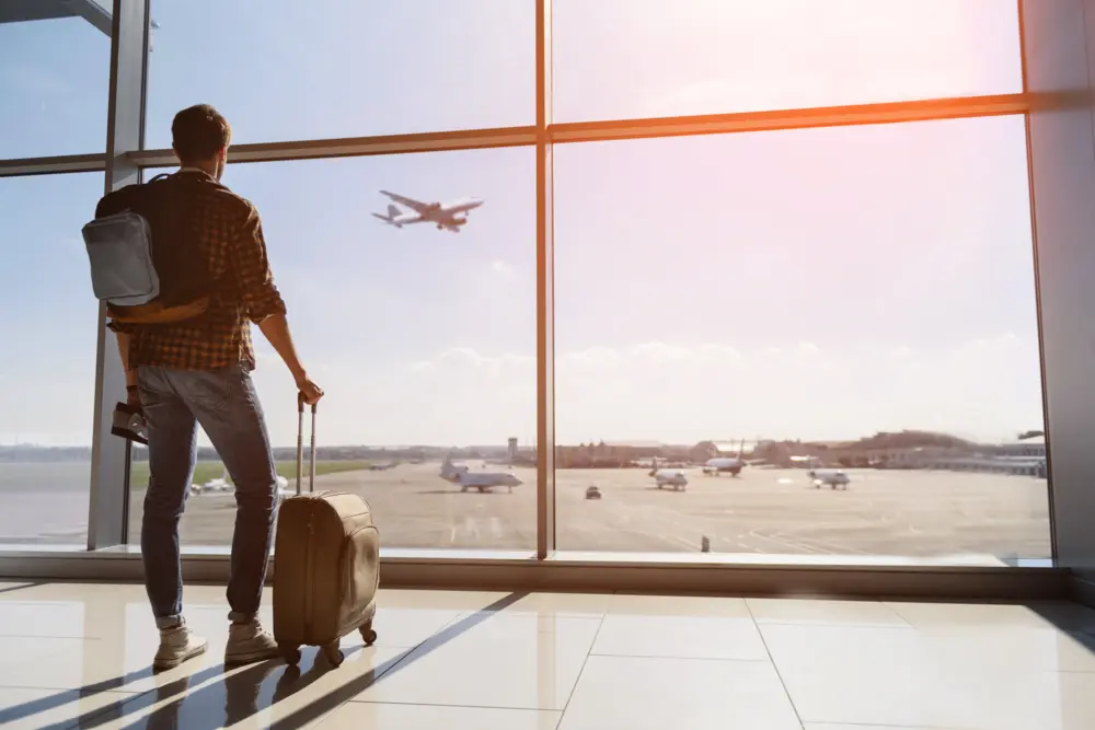 Man in airport preparing to board.