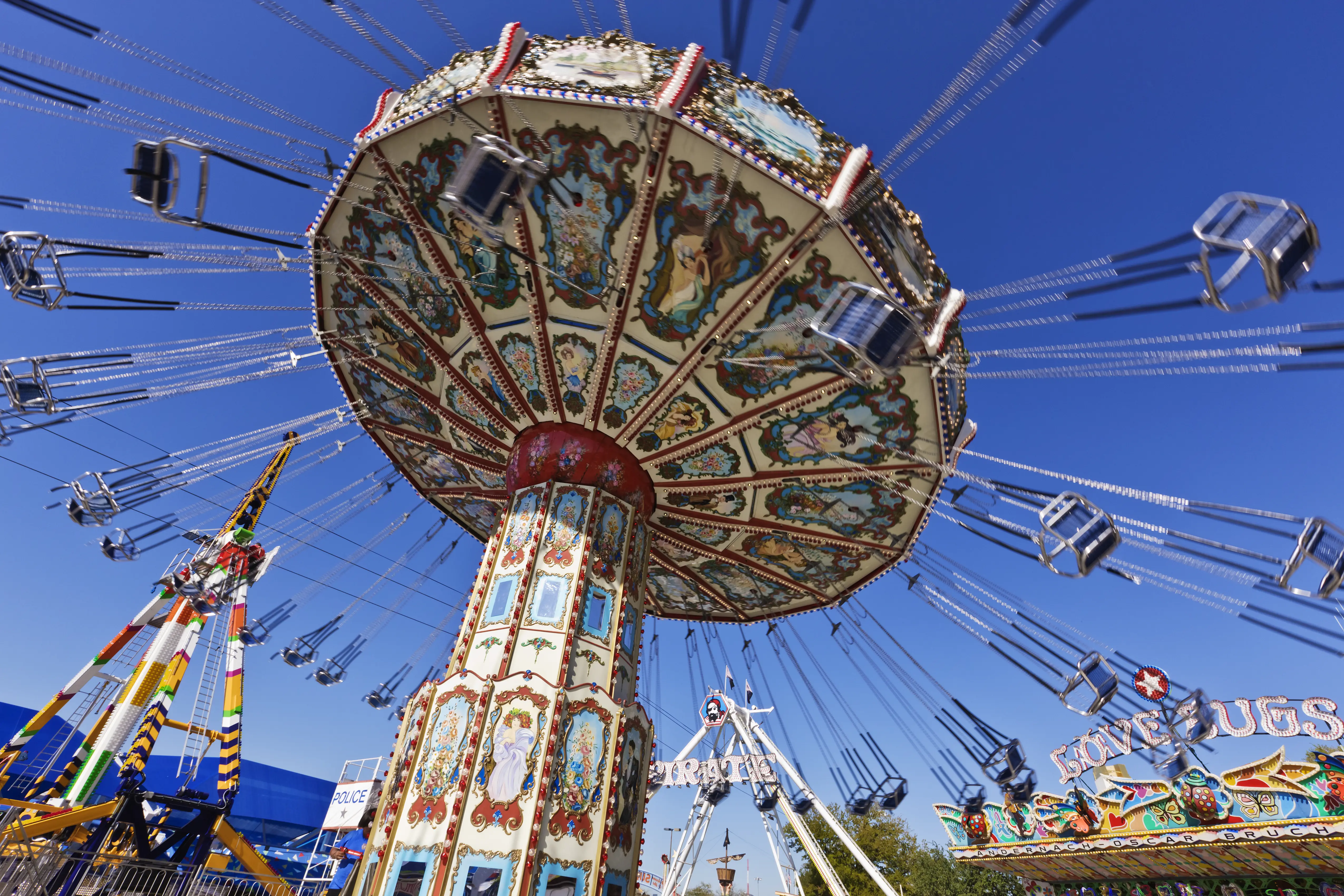 Image of a spinning and swinging chair ride at a fair.