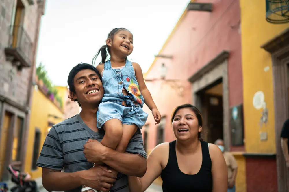 Family walking on the street in Mexico