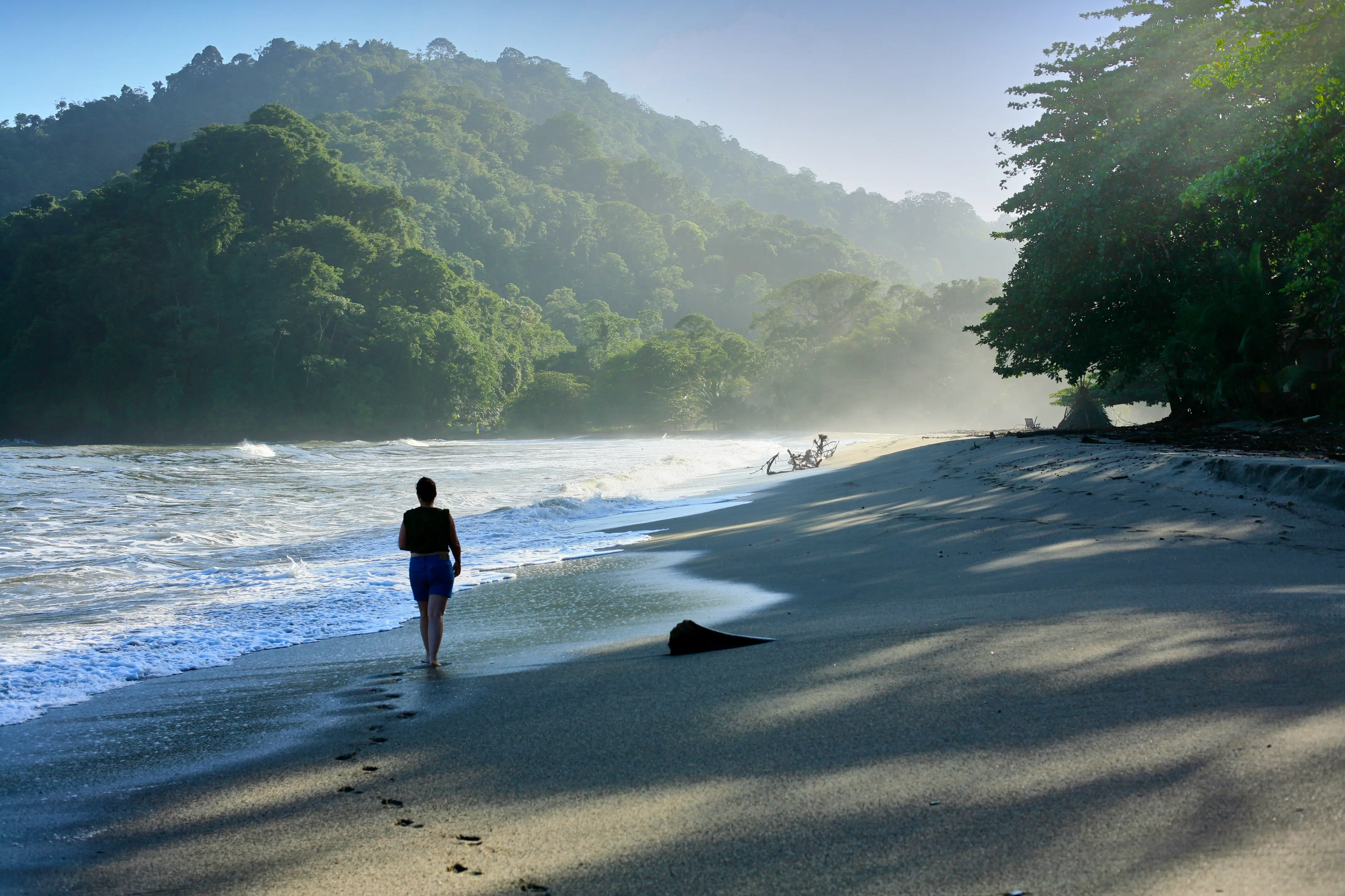 Image of a woman walking on Grand Riviere Beach in Trinidad.