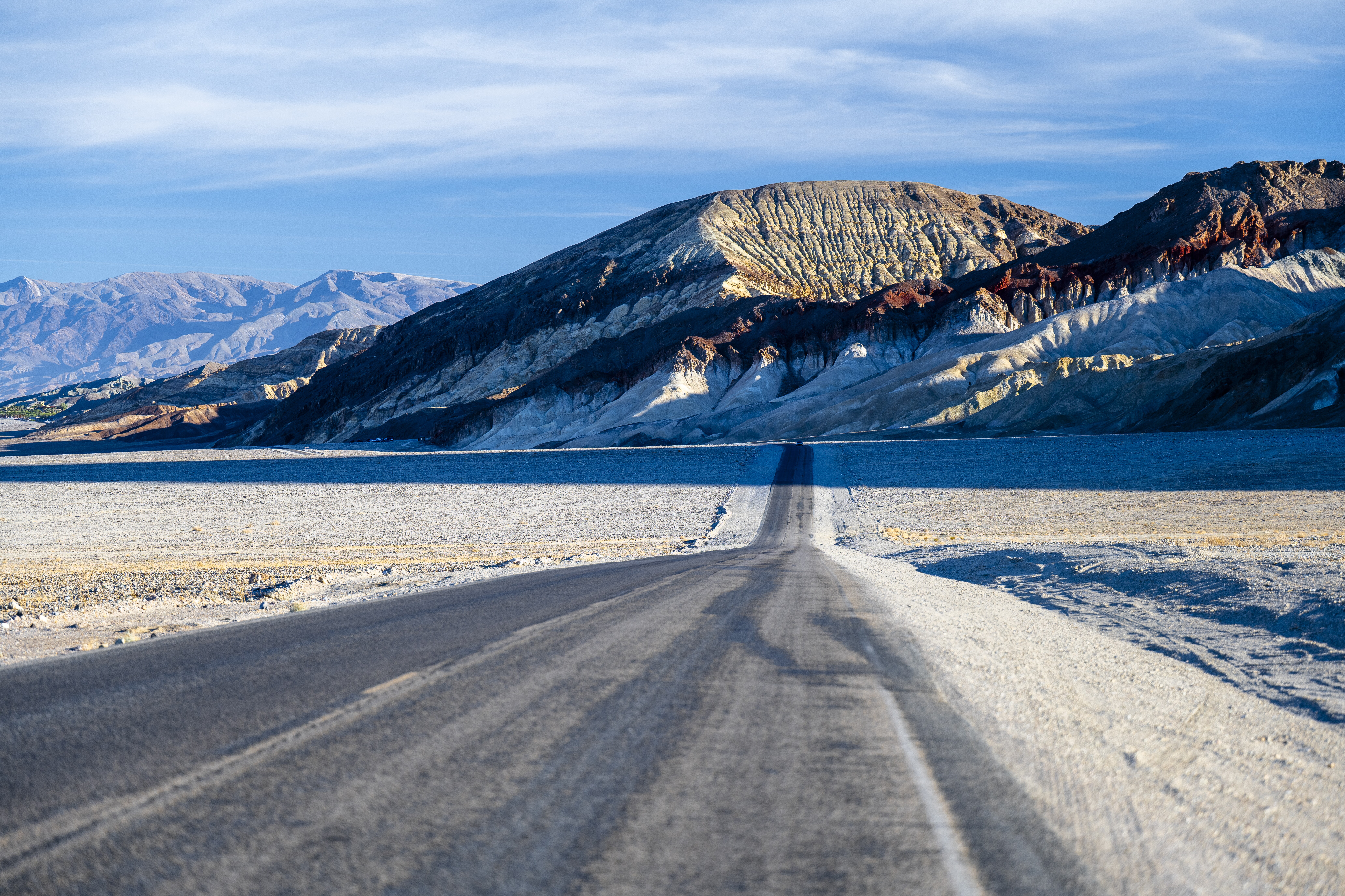 Image of a lone road stretching through Death Valley National Park.