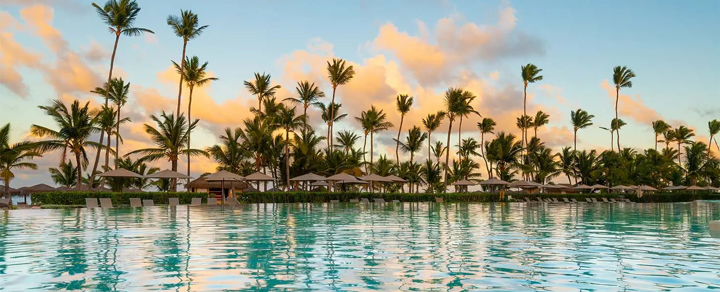 A wide shot of a resort hotel pool in Punta Cana, Dominican Republic.