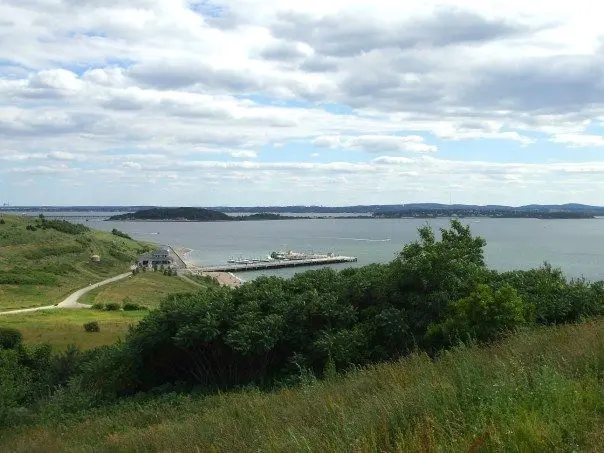 Outdoor image of the Spectacle Island marina and hillside.