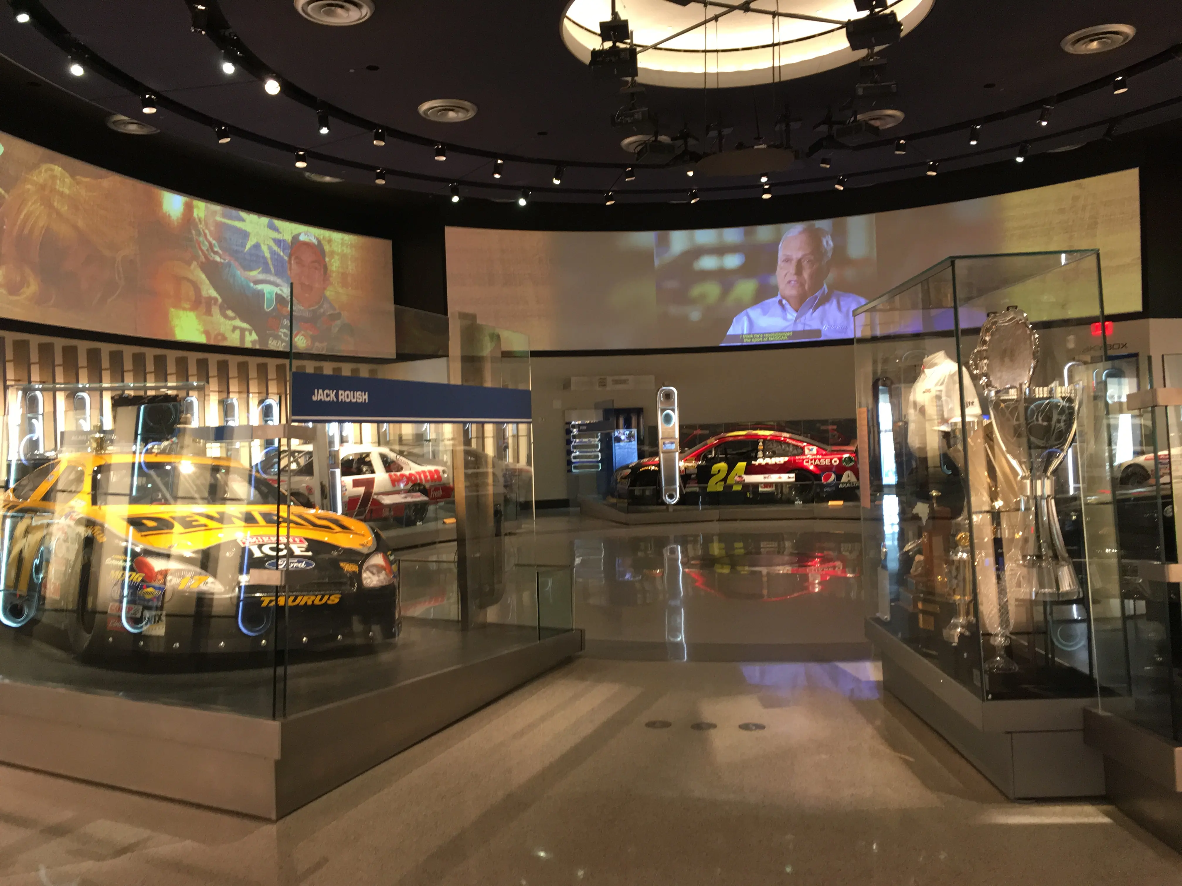 Interior picture of various vehicles on display at the NASCAR Hall of Fame
