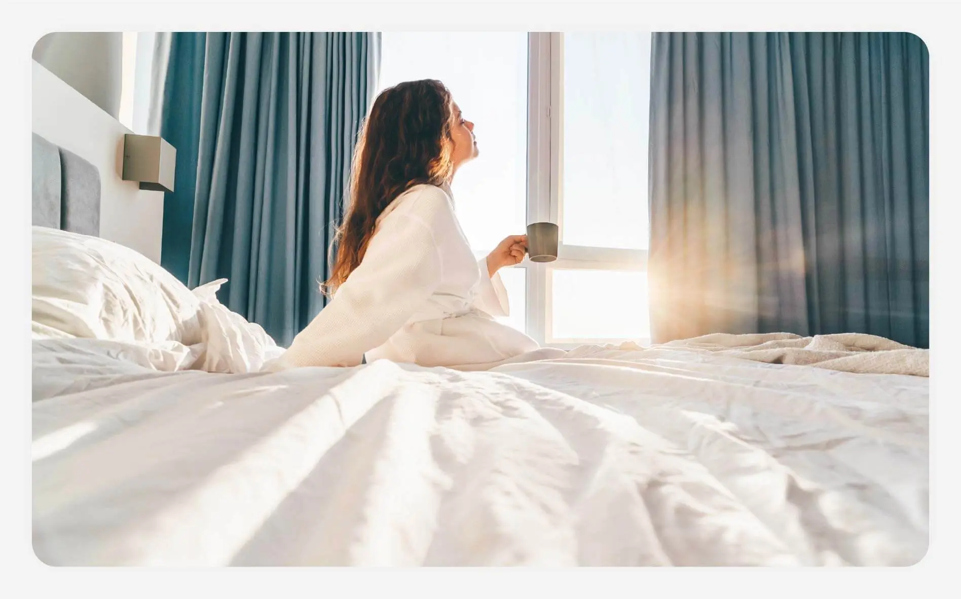 Solo female traveler relaxing in bed