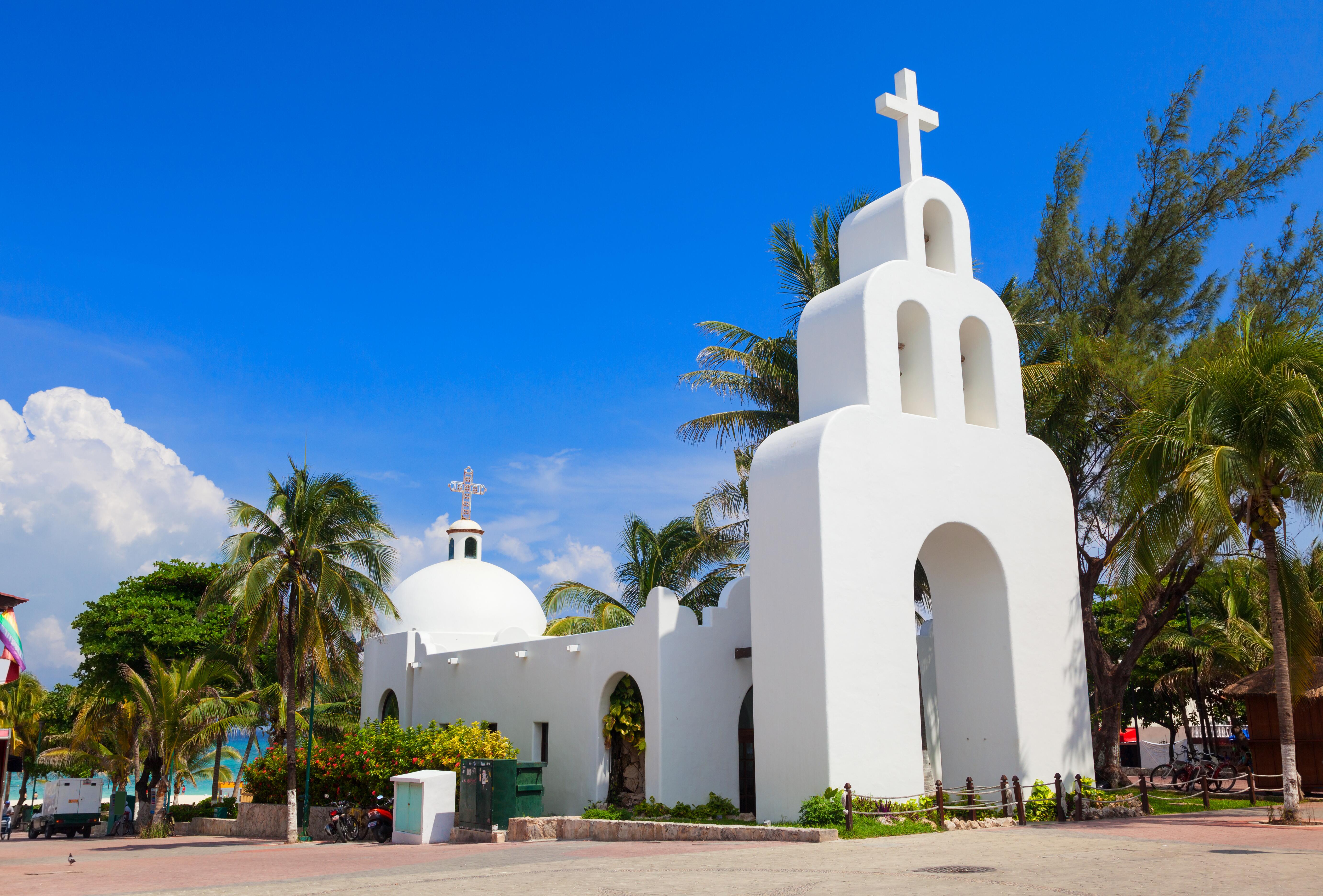 Sunny day view of Capilla de Nuestra Señora del Carmen, a white Mexican church