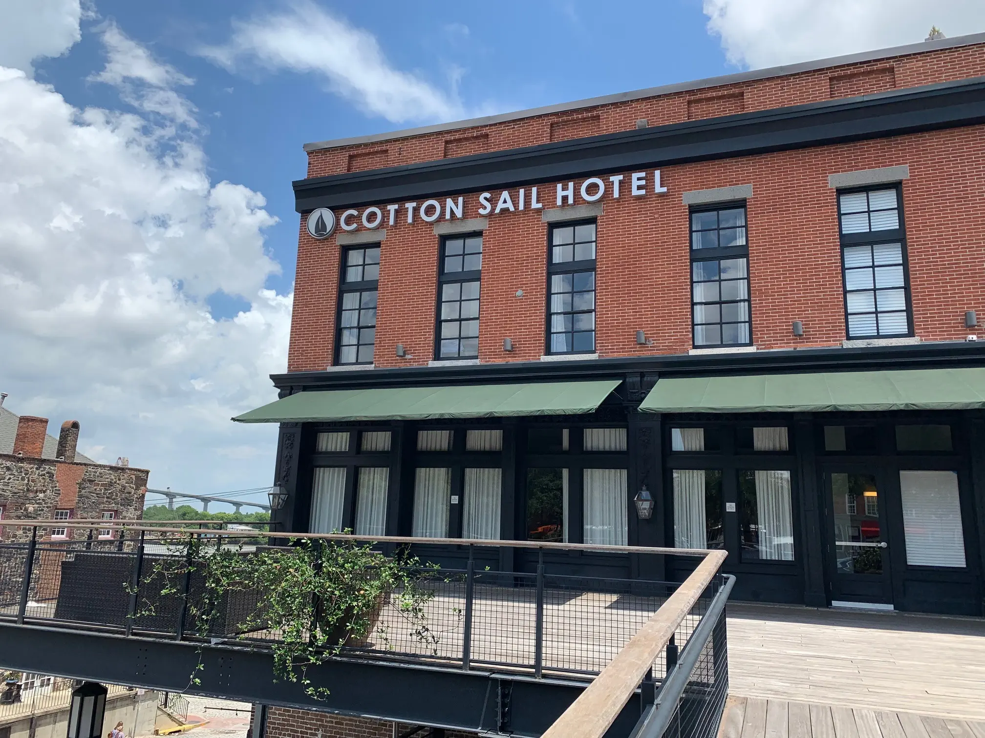 Historic brick exterior of The Cotton Sail Hotel in Savannah, Georgia.