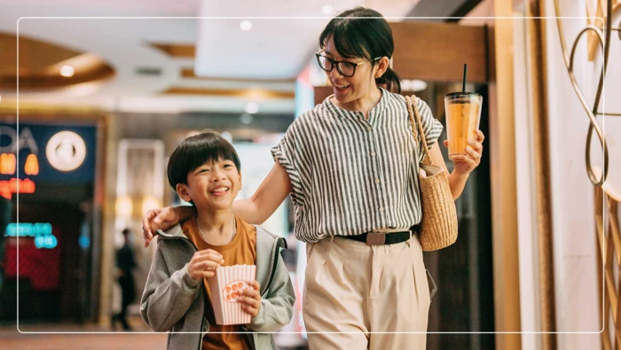 Mother and son at the movie theater. 