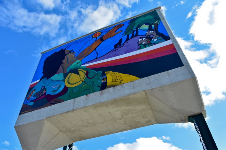 Colorful mural by Mike Valcourt on the Historic Rail Bridge at The Forks in Winnipeg, Manitoba.