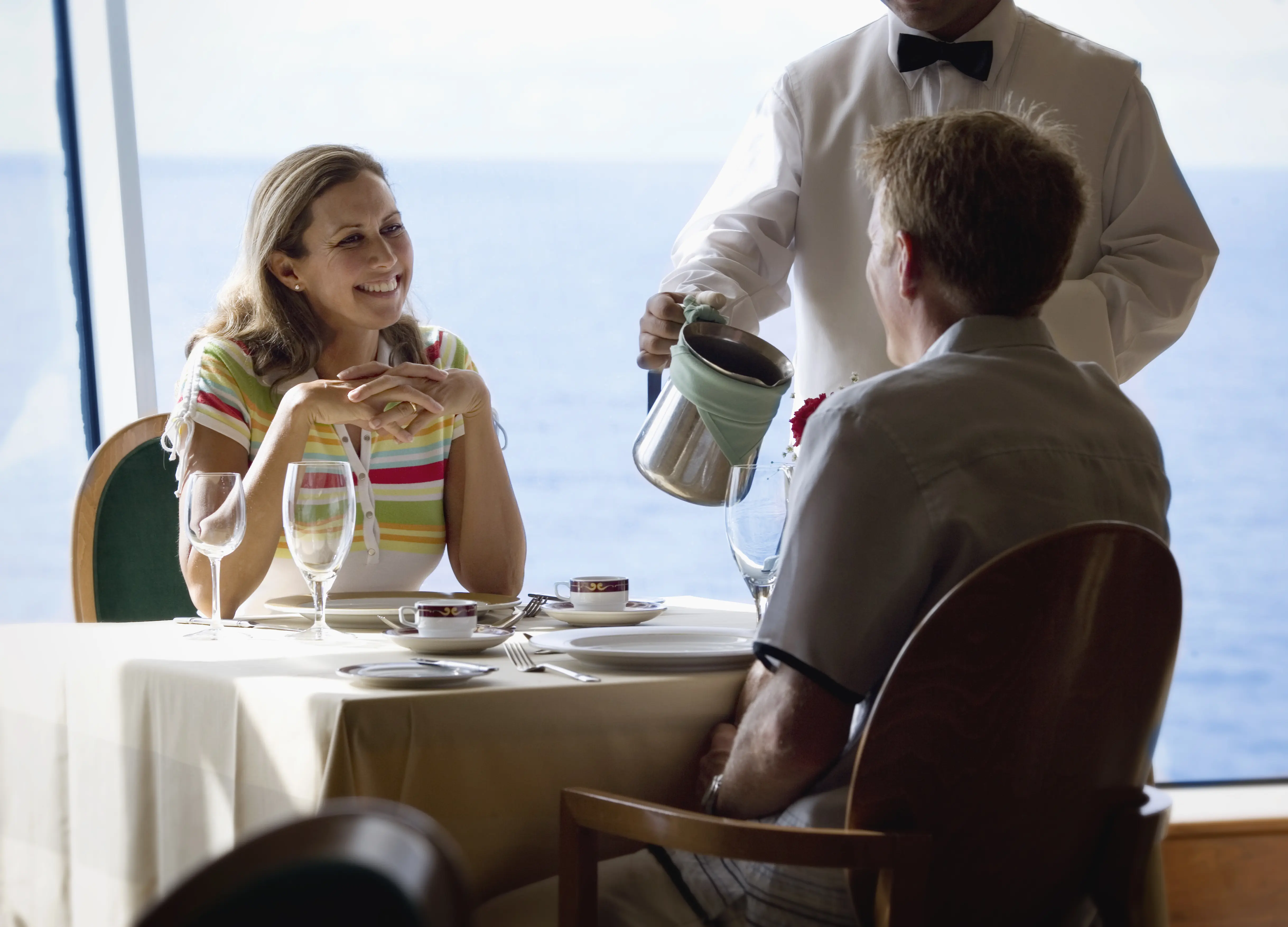 Image of a couple having dinner together on a cruise ship.
