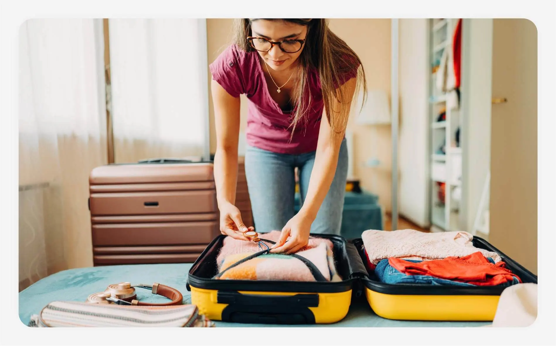Solo female traveler packing her suitcase