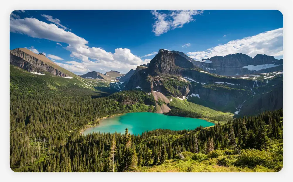 a scenic view of the lake in glacier national park