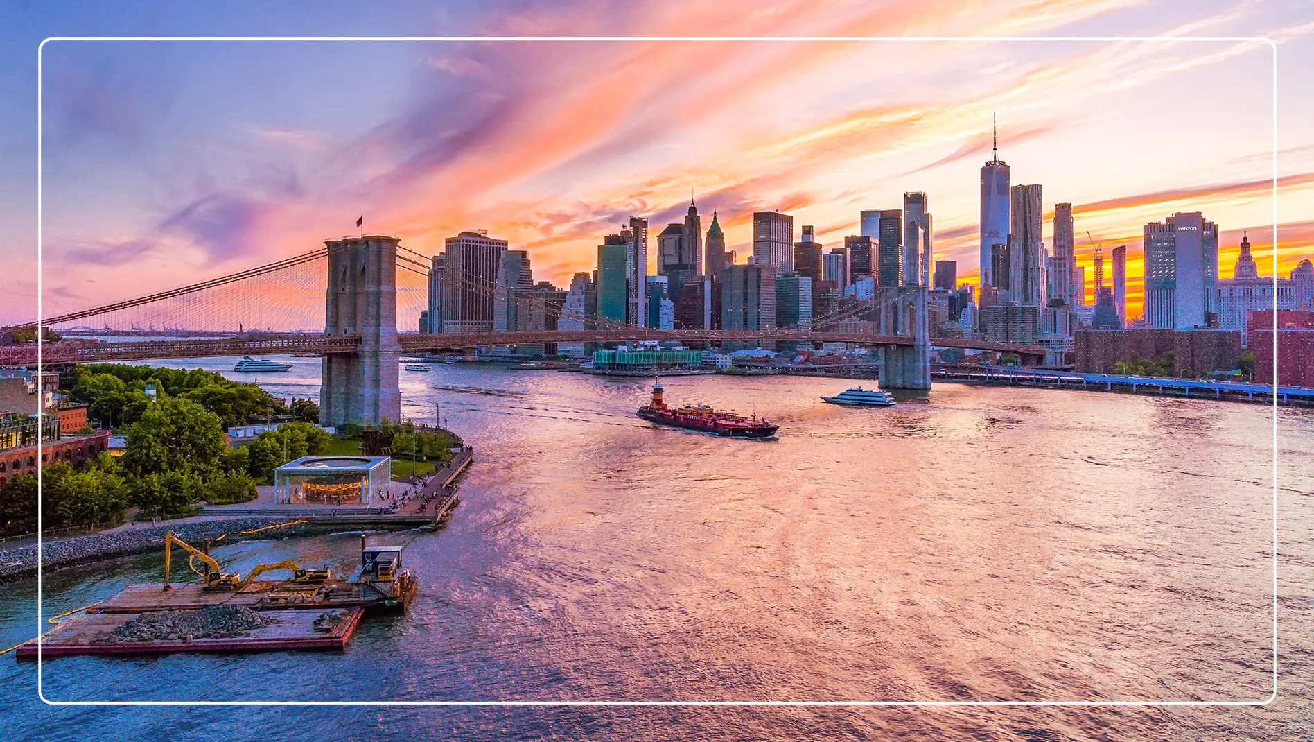 The cityscape of New York City at sunset.