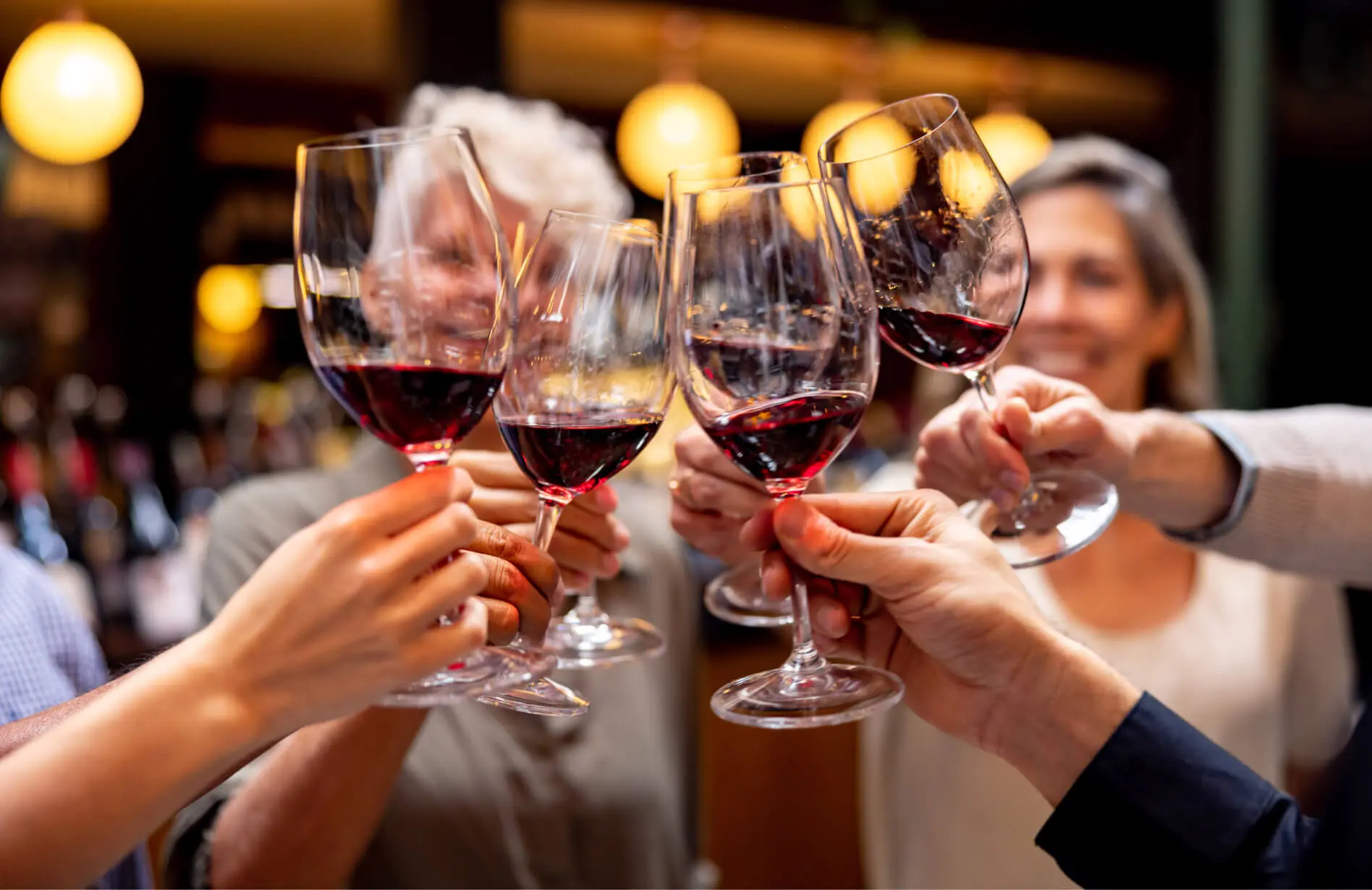 A group of older travelers raising a toast.