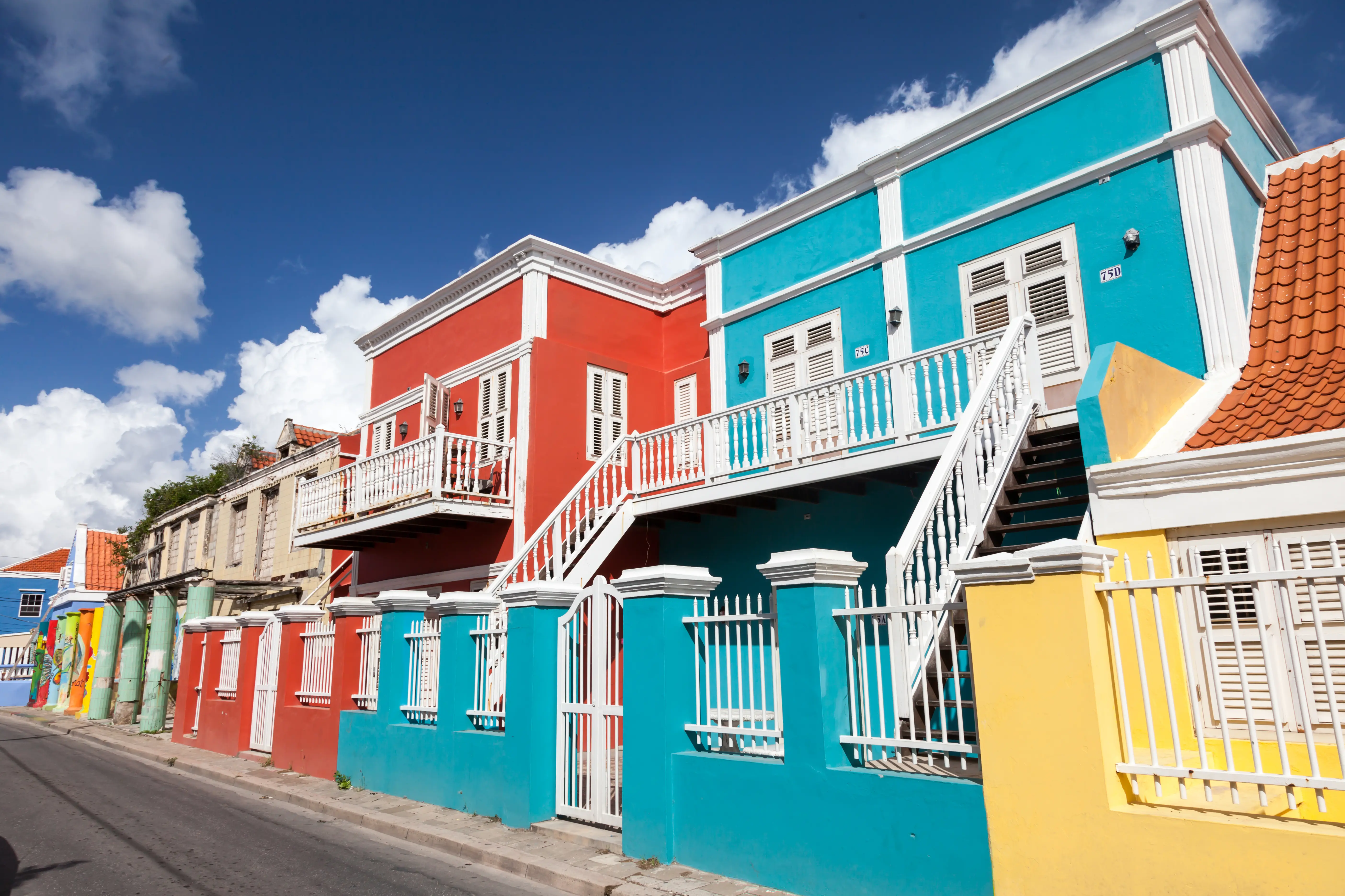 Image of a row of colorful homes in Willemstad, Curaçao.