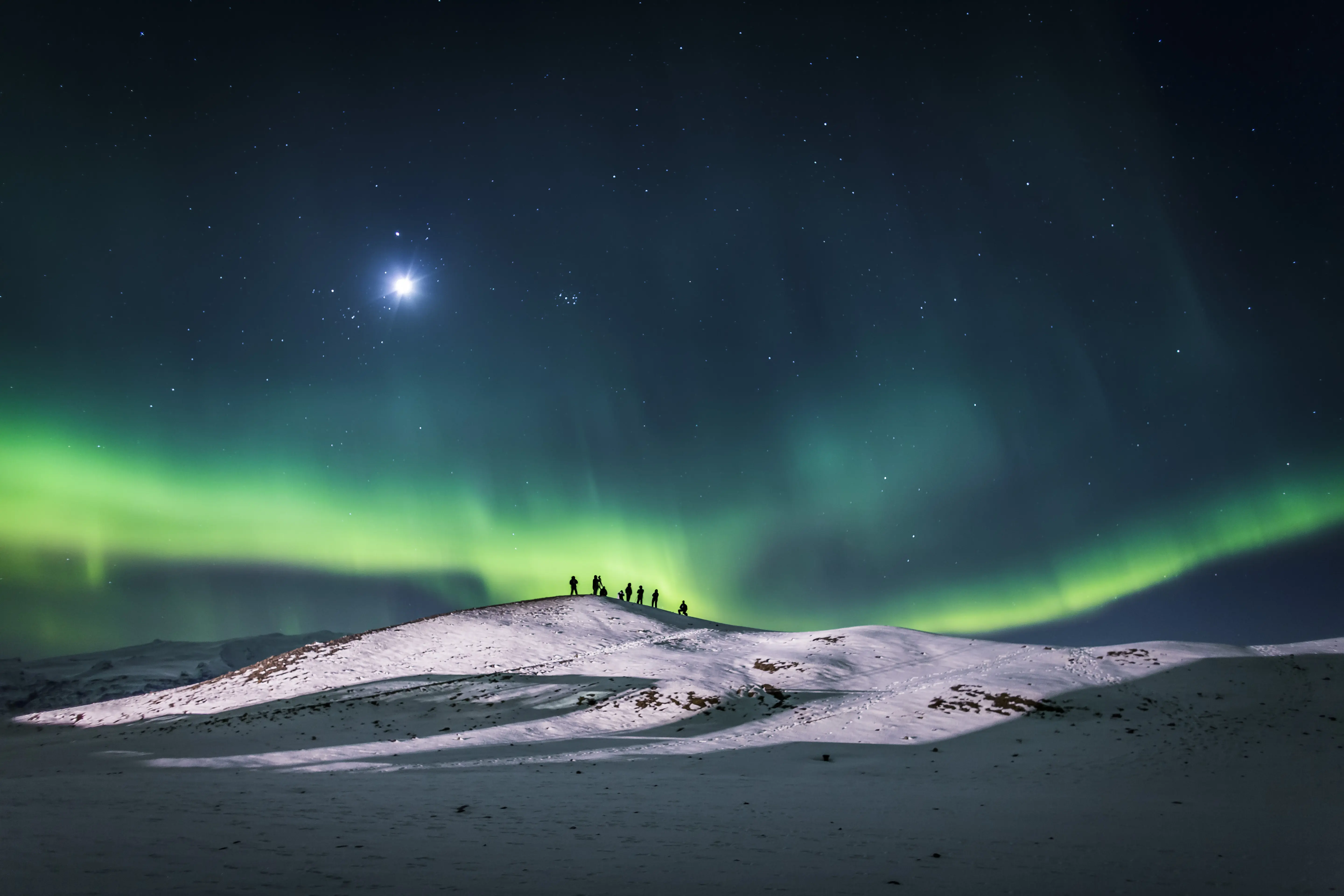 Photo of scenic Northern lights in the sky at night