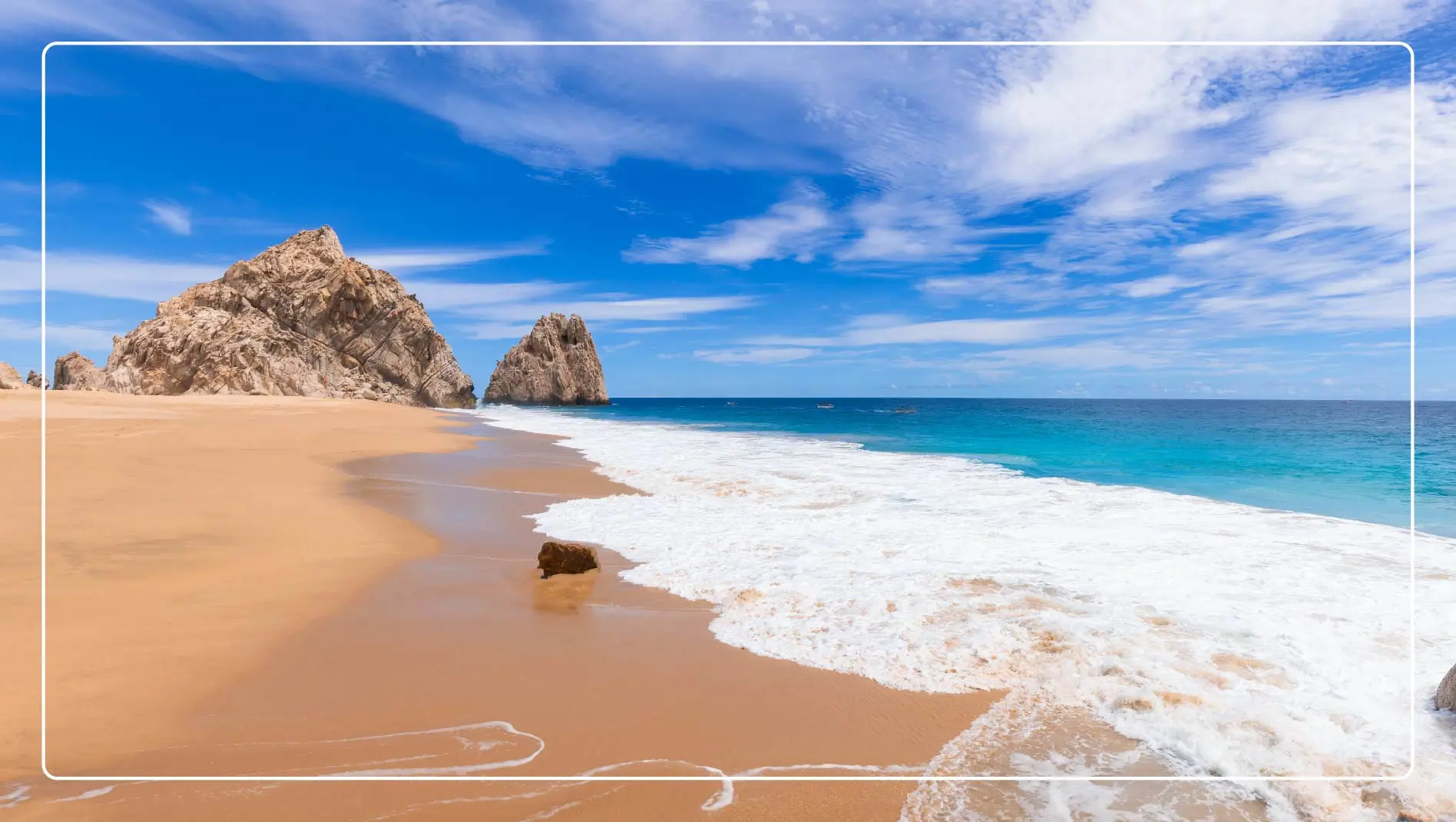 Waves roll onto the shore at a beach in Los Cabos, Mexico.