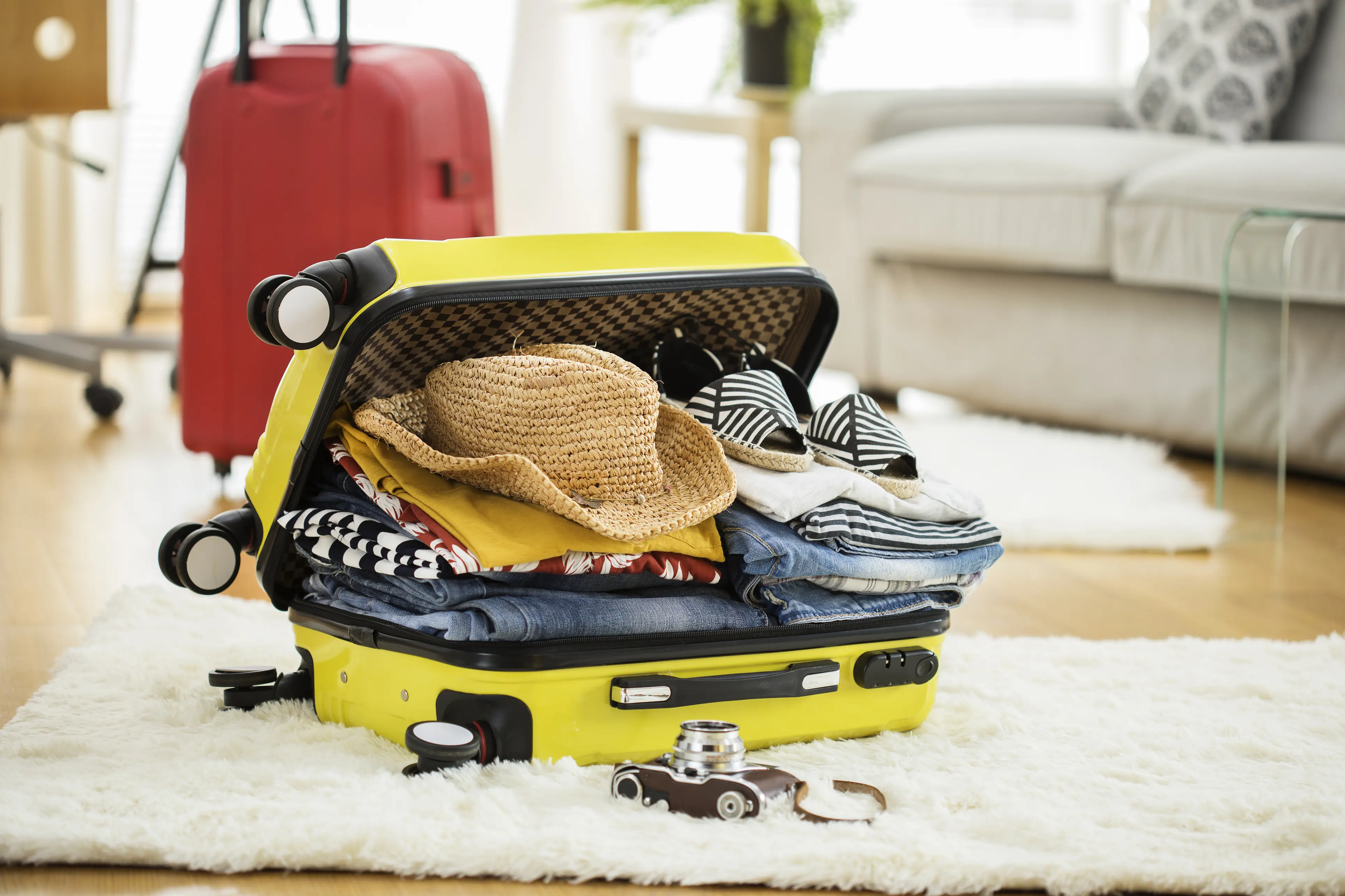 Suitcase packed on floor