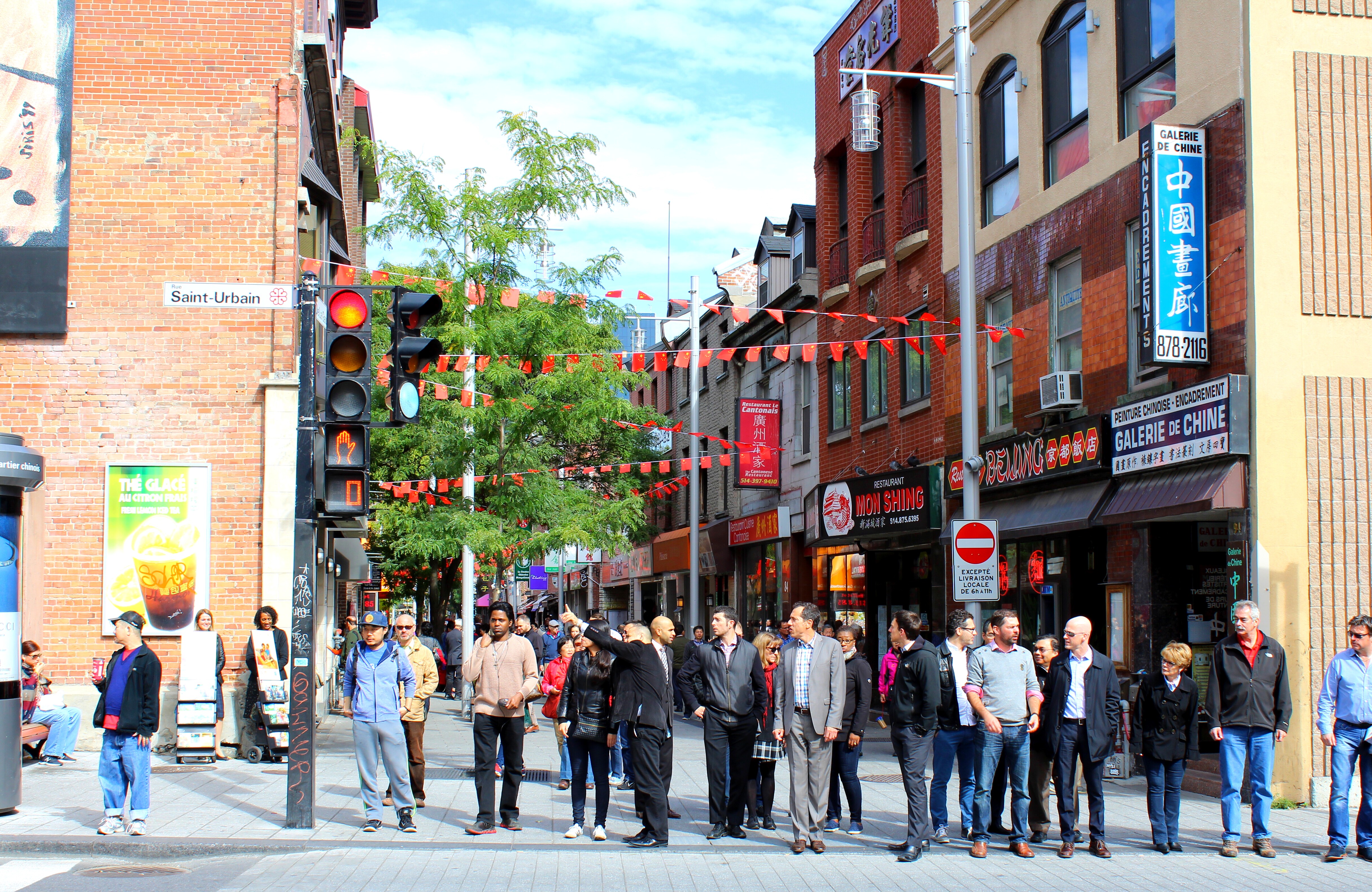 Shoppers walk the busy streets of Montreal.