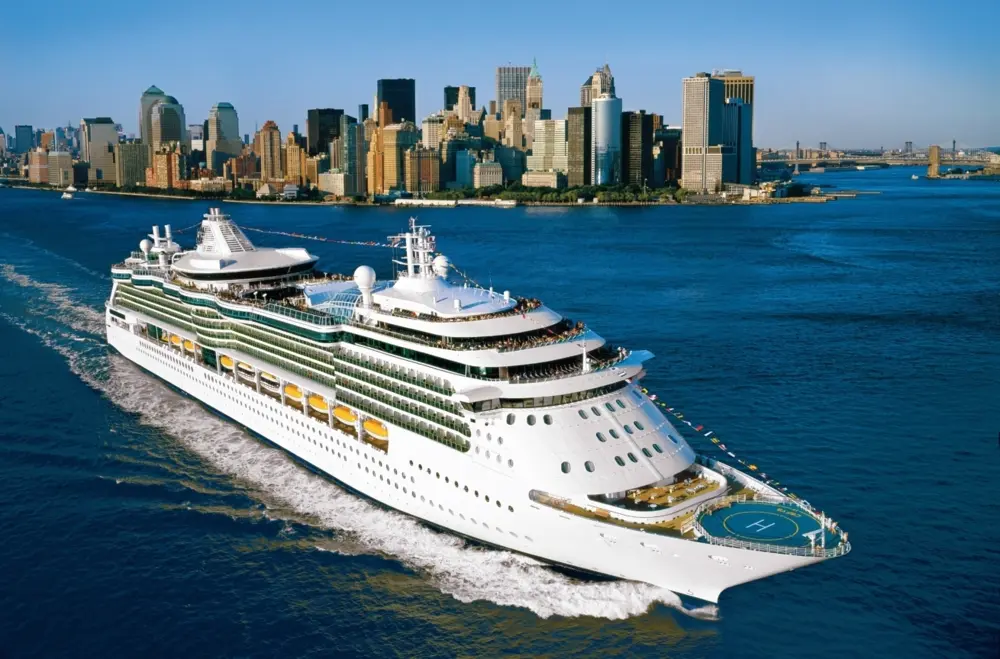 Royal Caribbean cruise ship with the New York City skyline in the background.