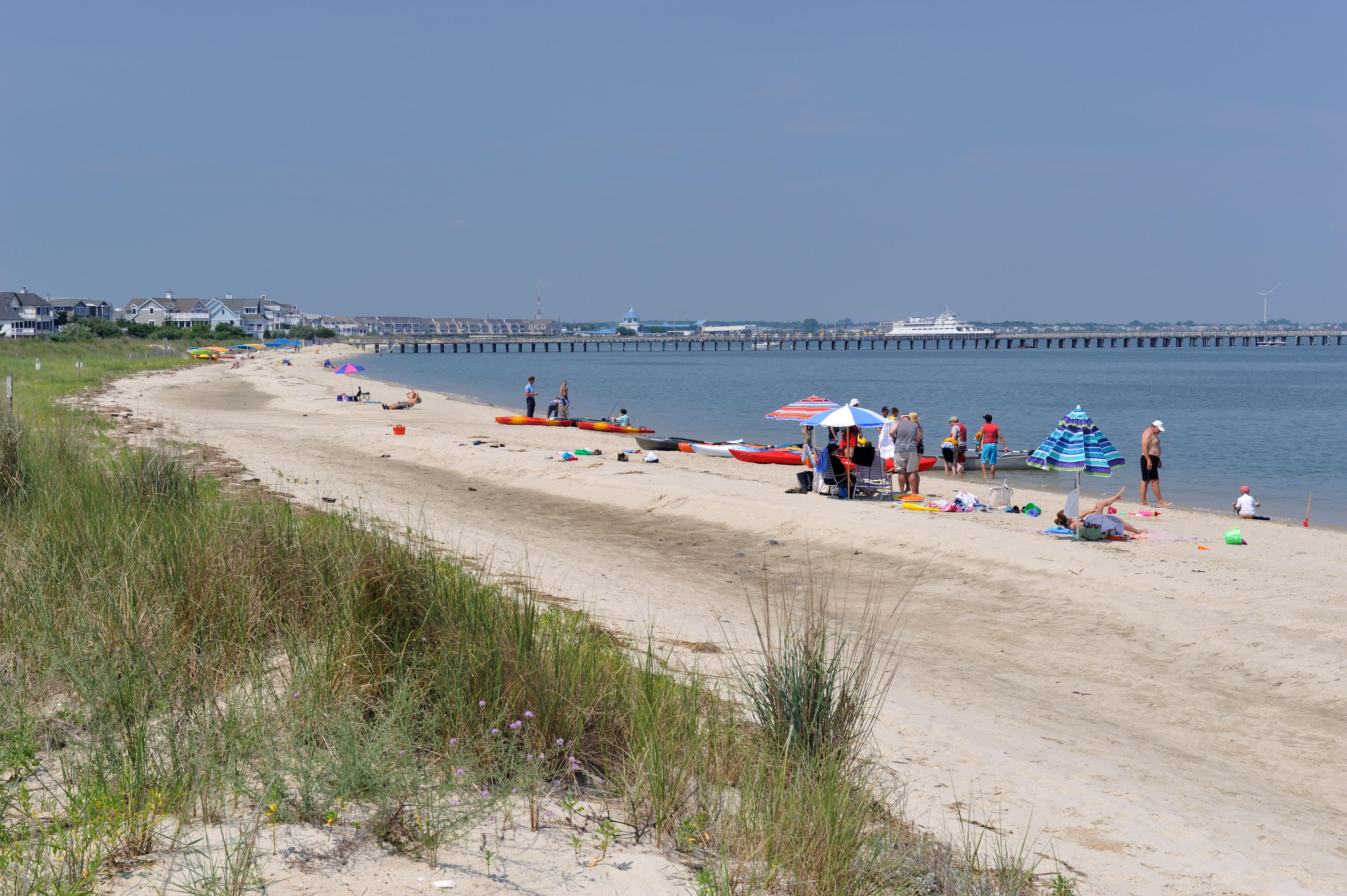Image of beachgoers enjoying Broadkill Beach in Delaware.