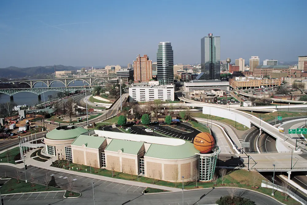 Birds-eye view of the Women's Basketball Hall of Fame with the Knoxville skyline in the background.