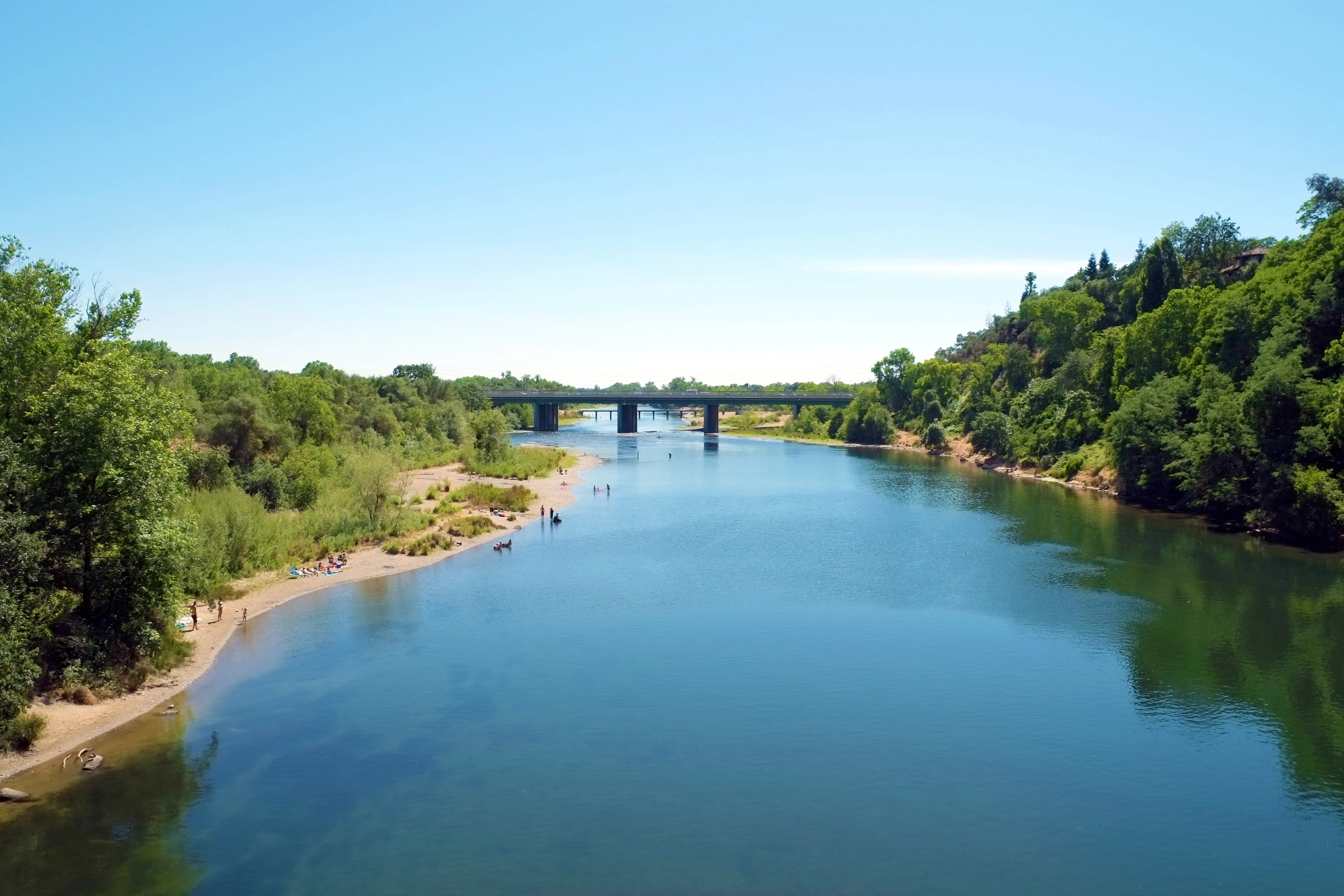 Sunny day aerial view of American River and beach in Sacramento, California