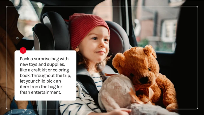 A child in a car seat with her stuffed animals. 