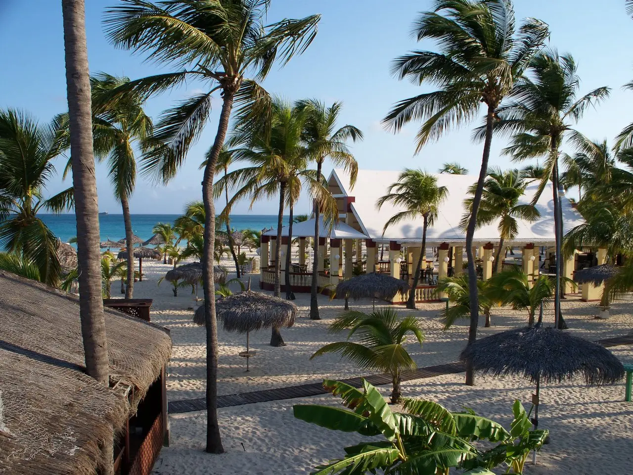 Image of Manchebo Beach and other nearby businesses in Aruba.