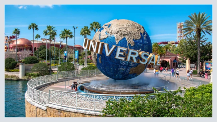 A picture of the Universal Studios globe is captured on a clear day. 