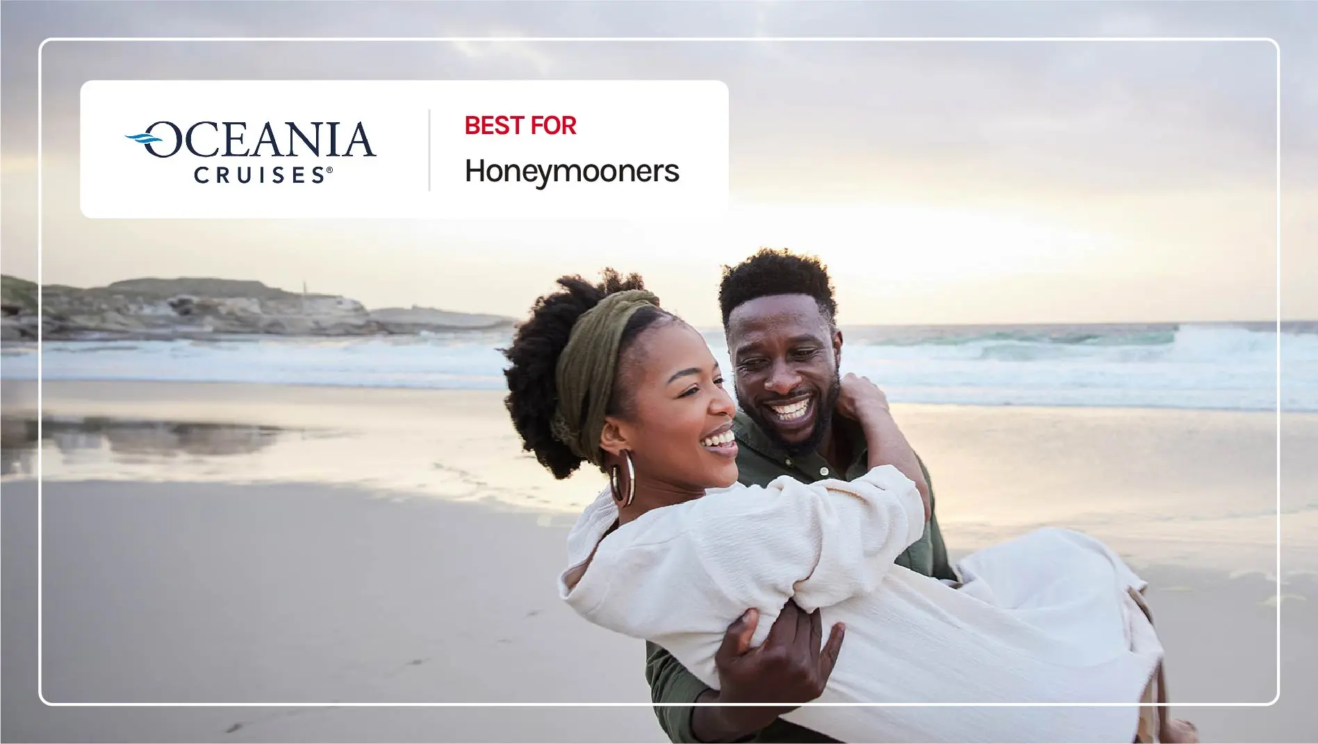 A man carries his wife on the beach on their honeymoon.