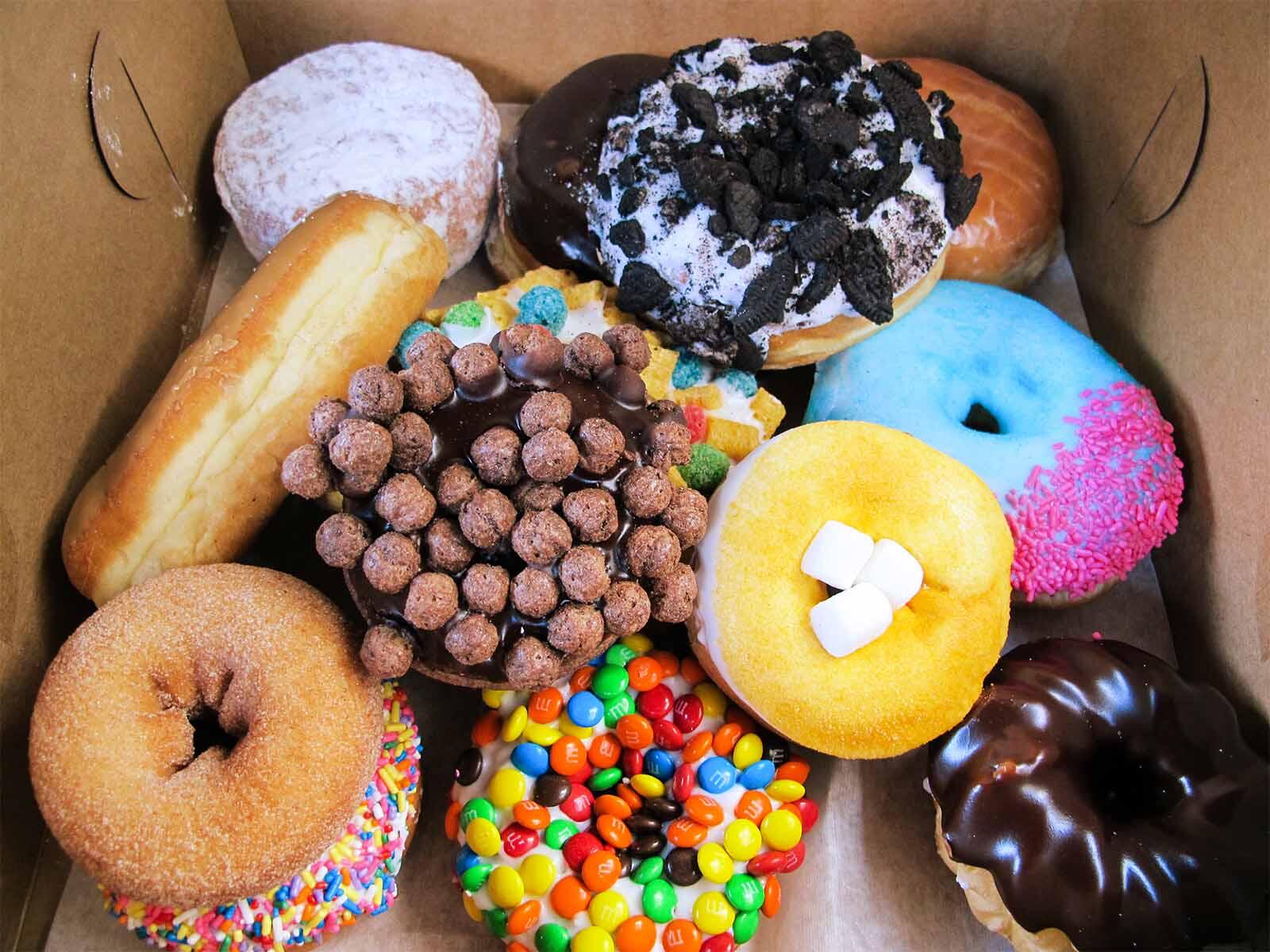 A box of unique and vibrant donuts