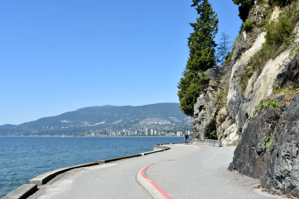 Cyclist on the waterfront Stanley Park Seawall in Vancouver British Columbia